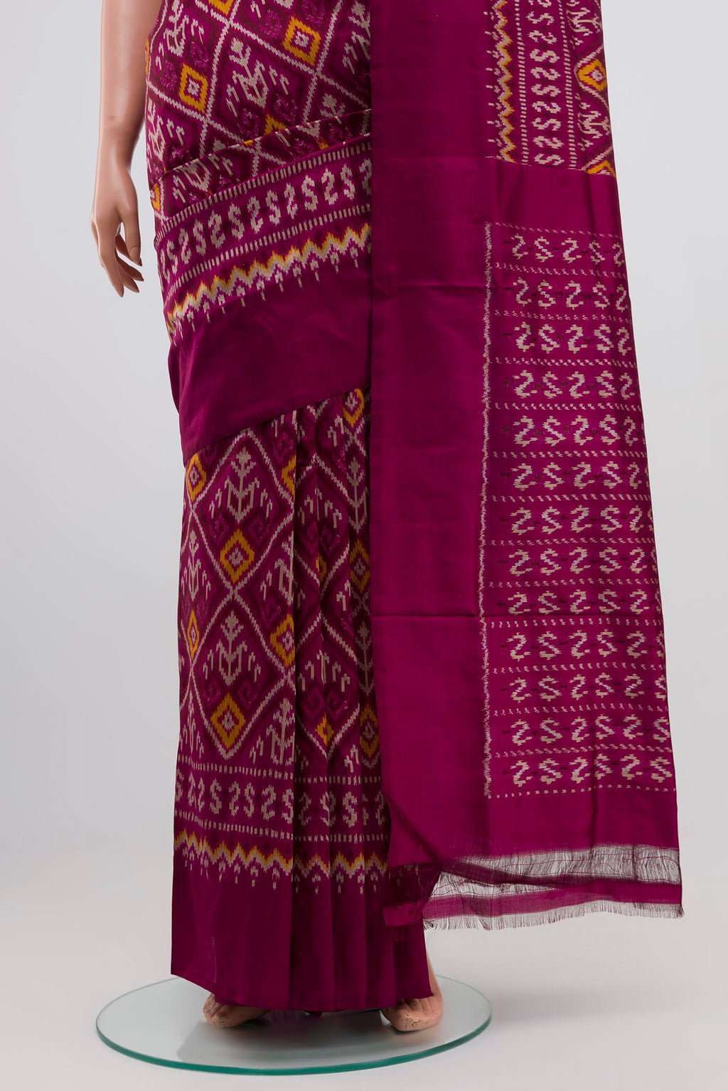Pleats and pallu of Purple Pochampally Silk Saree with Ikat Print on the body and Plain Border. 