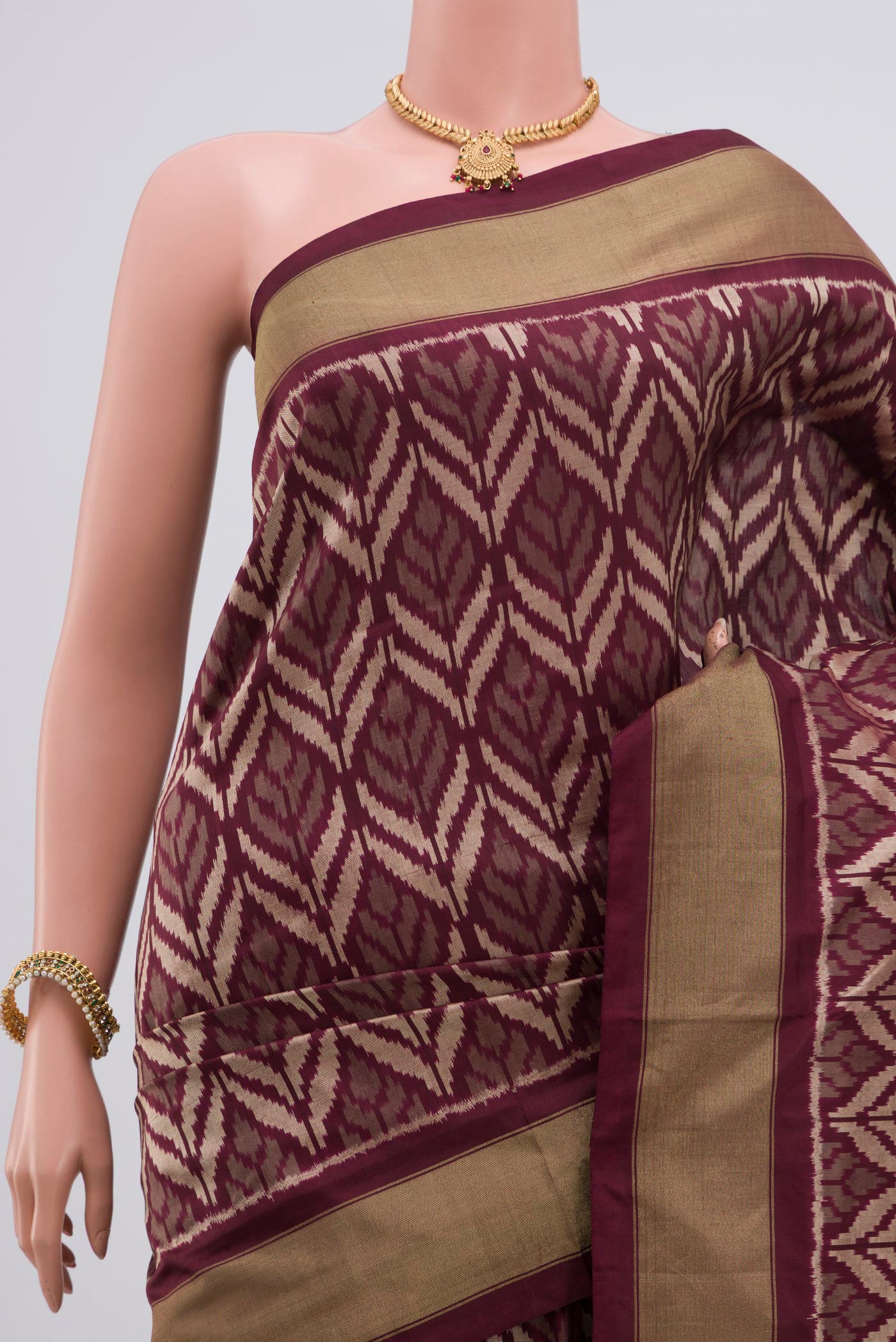 Border image of Brown Pochampally Silk Saree with Ikat Print on the body and Zari Border. 