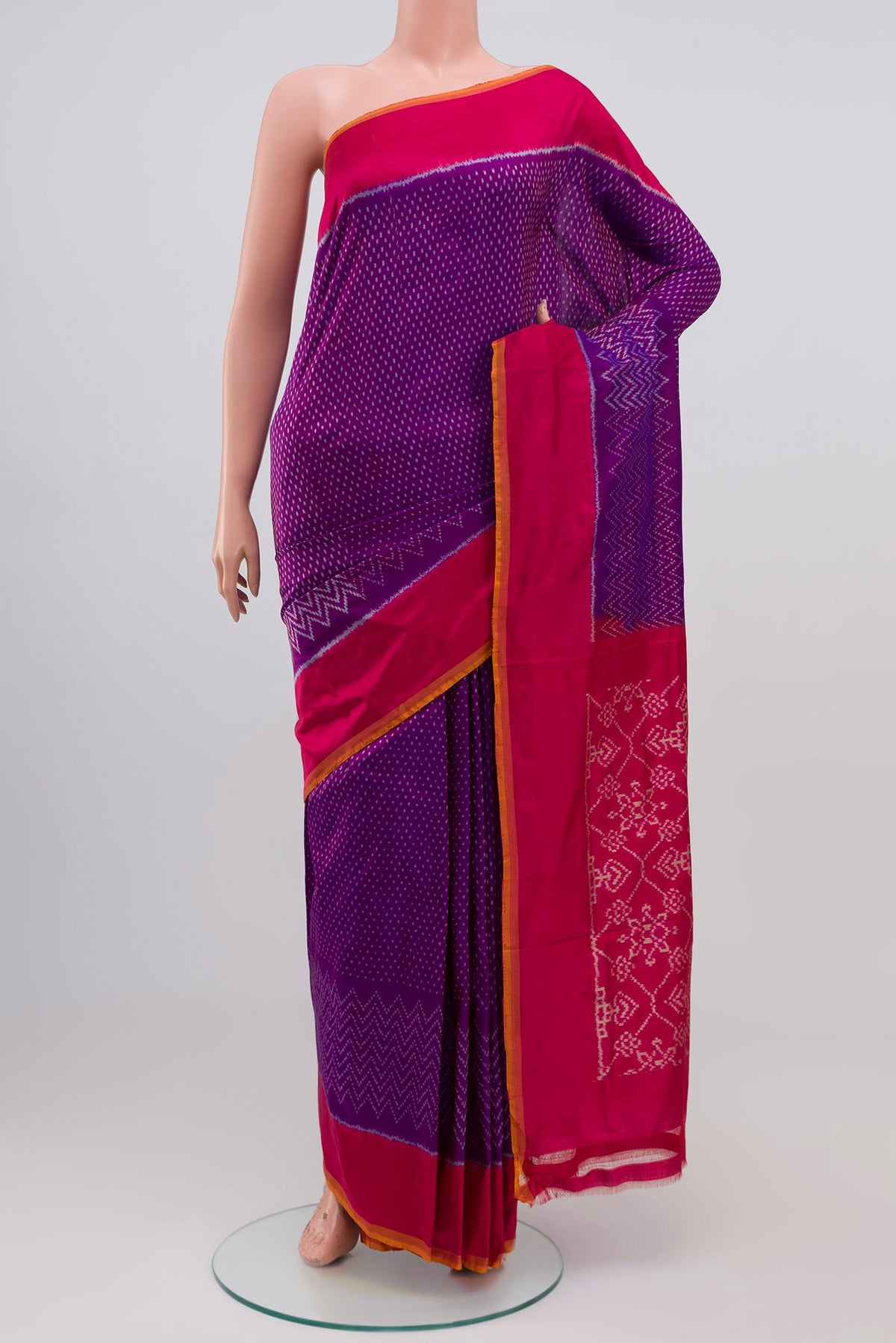 Purple Pochampally Silk Saree with Ikat design on the body and Plain Border.  displayed on a mannequin