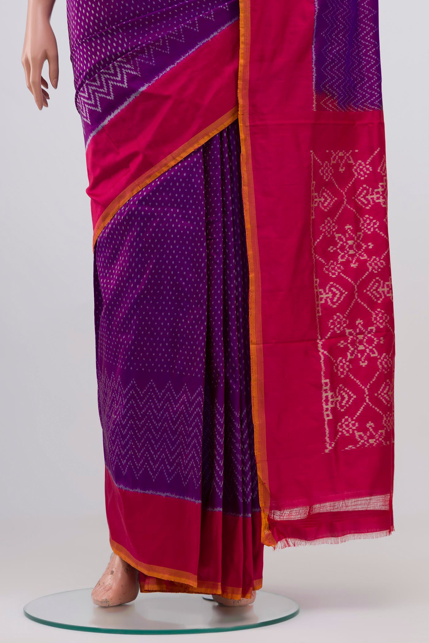 Pleats and pallu of Purple Pochampally Silk Saree with Ikat design on the body and Plain Border. 