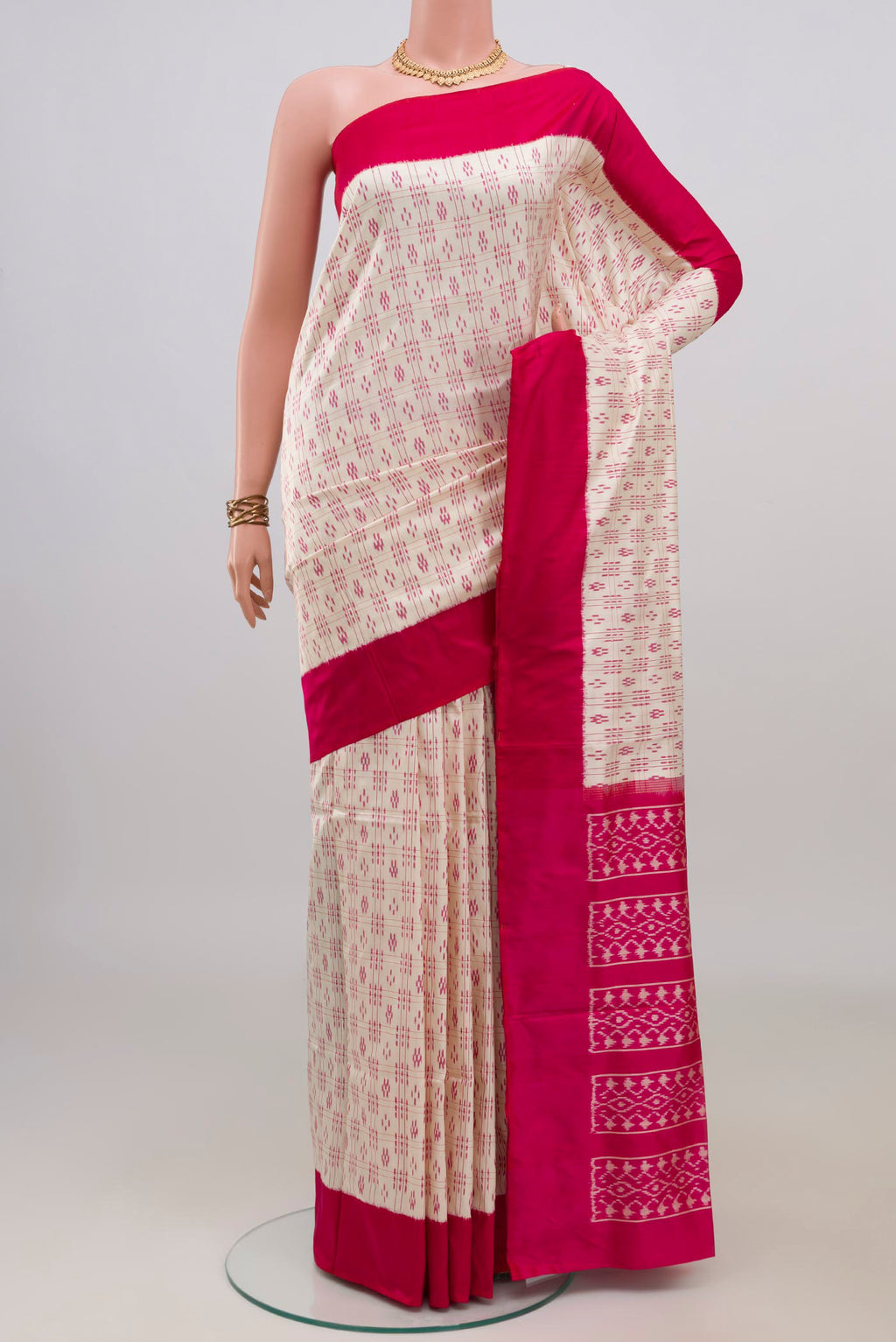 Pure Silk Cream Pochampally Saree with Pure Ikat on the body and Plain Border.  displayed on a mannequin
