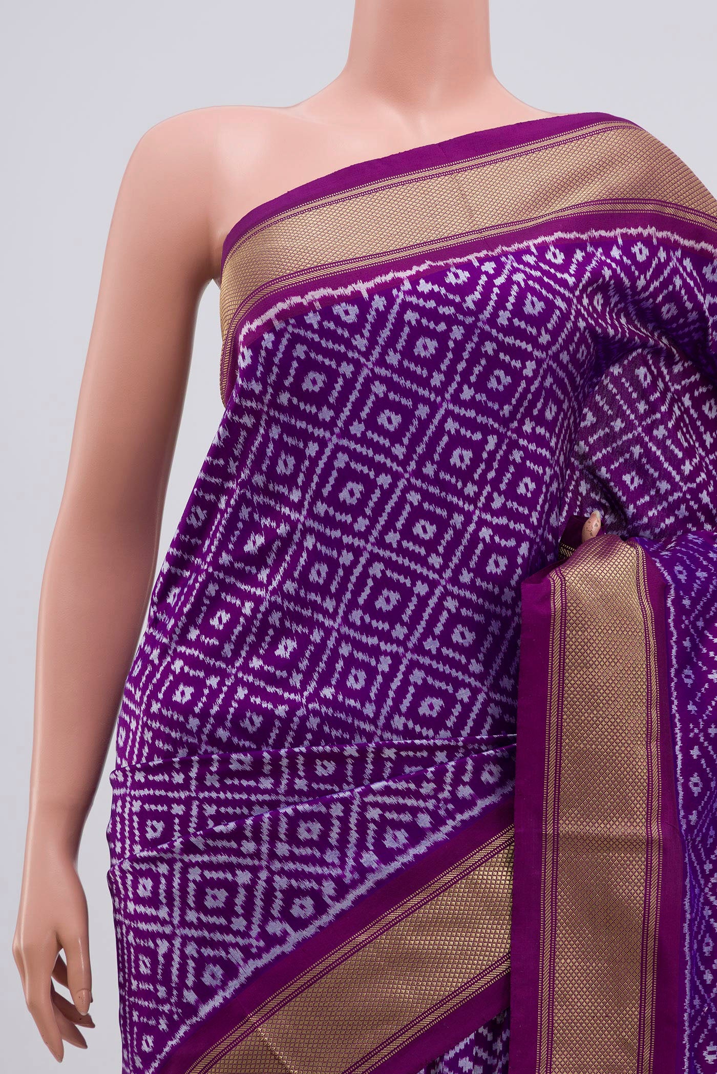 Border image of Purple Pochampally Silk Saree with Ikat Print on the body and Zari Border. 