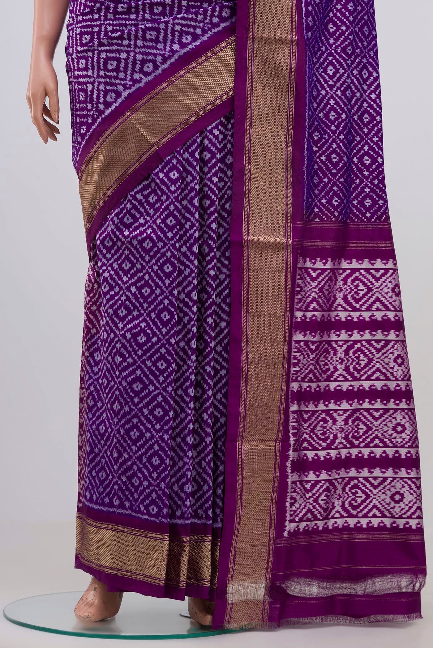 Pleats and pallu of Purple Pochampally Silk Saree with Ikat Print on the body and Zari Border. 