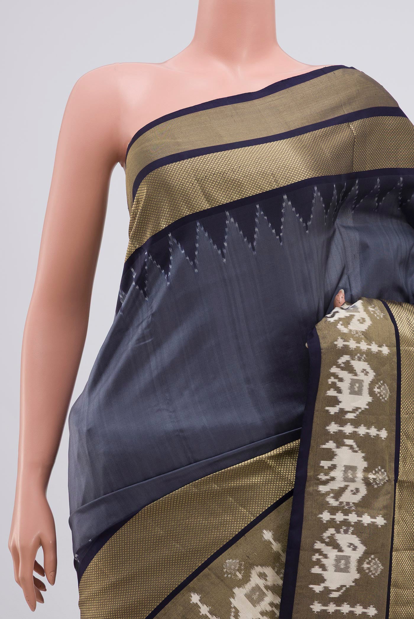 Border image of Grey Pochampally Silk Saree with Ikat design on the body and Zari Border. 