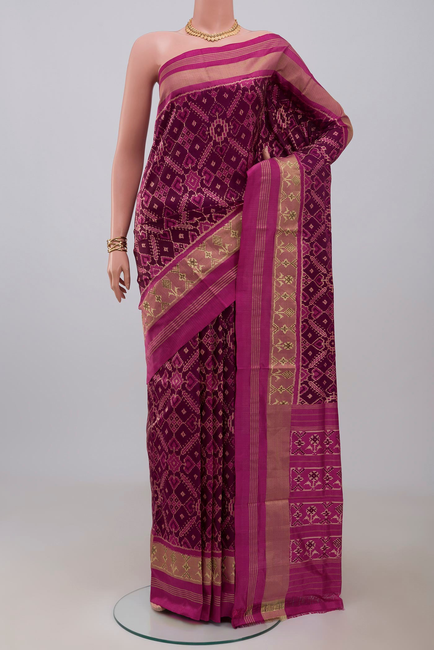 Multi Color Pochampally Silk Saree with Ikat design on the body and Zari Border.  displayed on a mannequin