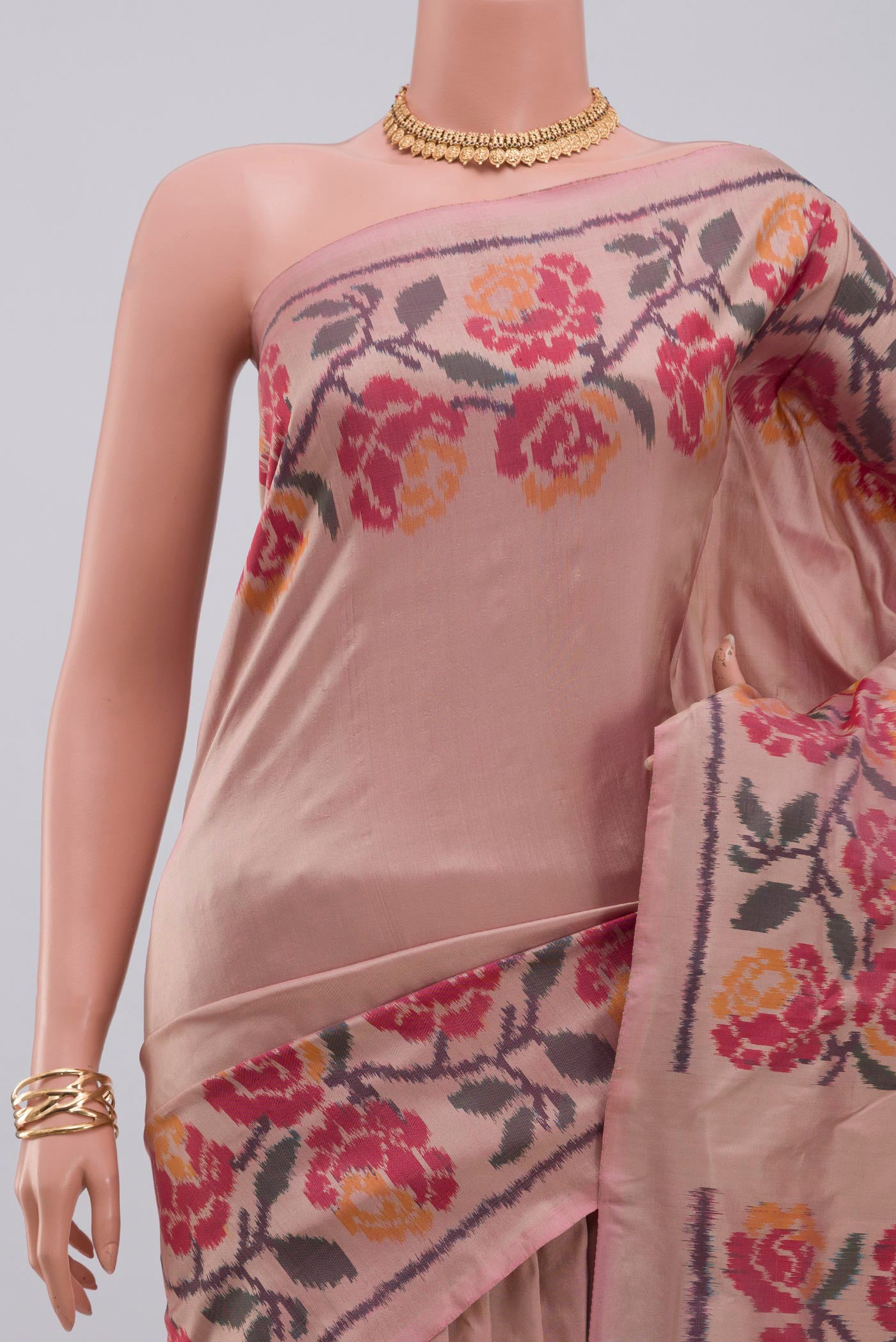 Border image of Peach Pochampally Silk Saree with Ikat design on the body and Ikat Border. 