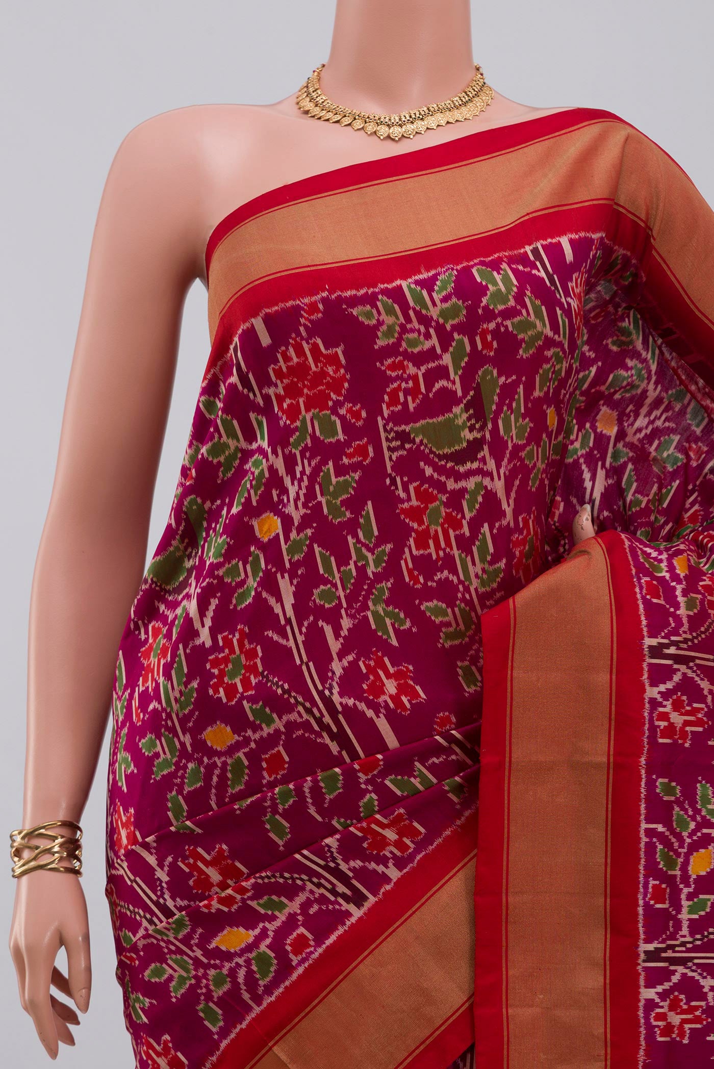 Border image of Magenta Pochampally Saree with Ikat design on the body and Zari Border. 