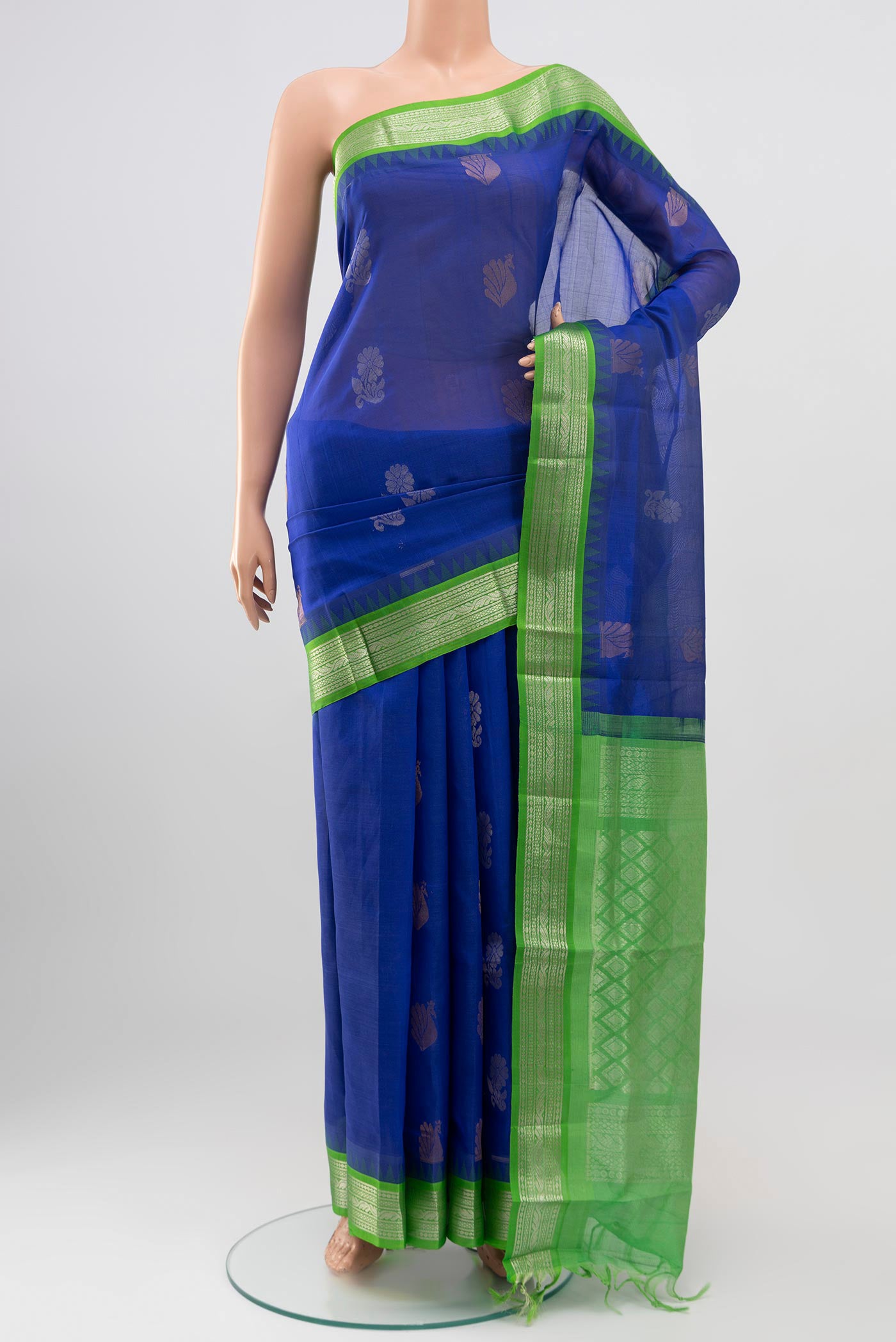 Blue Silk Cotton Saree with Zari Butta on the body and Zari Border.  displayed on a mannequin