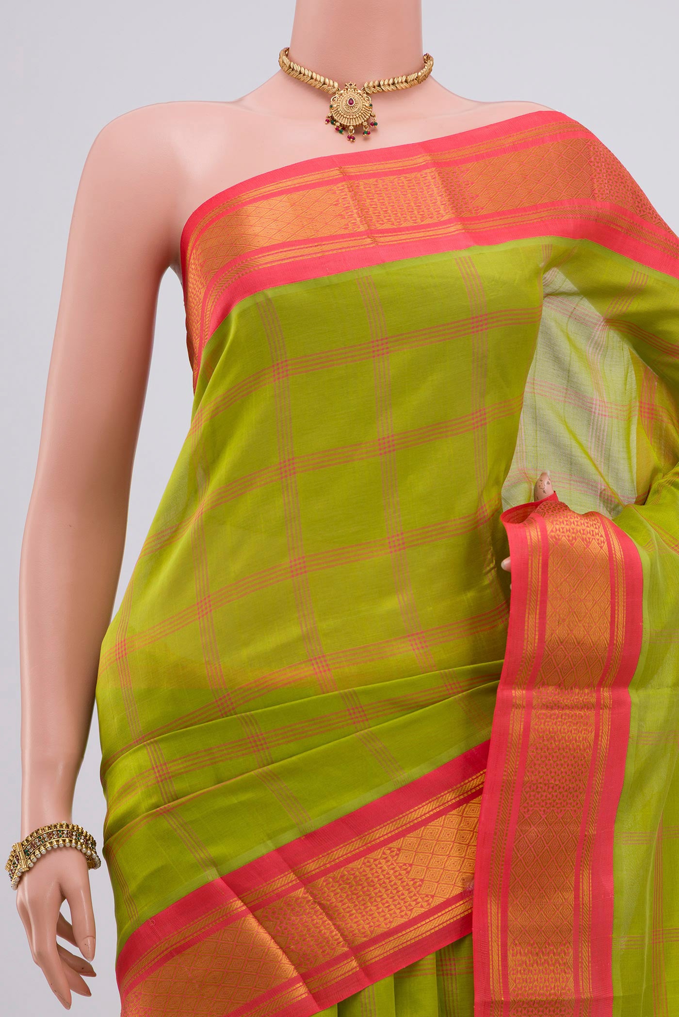 Border image of Green Silk Cotton Saree with Checked design on the body and Zari Border. 