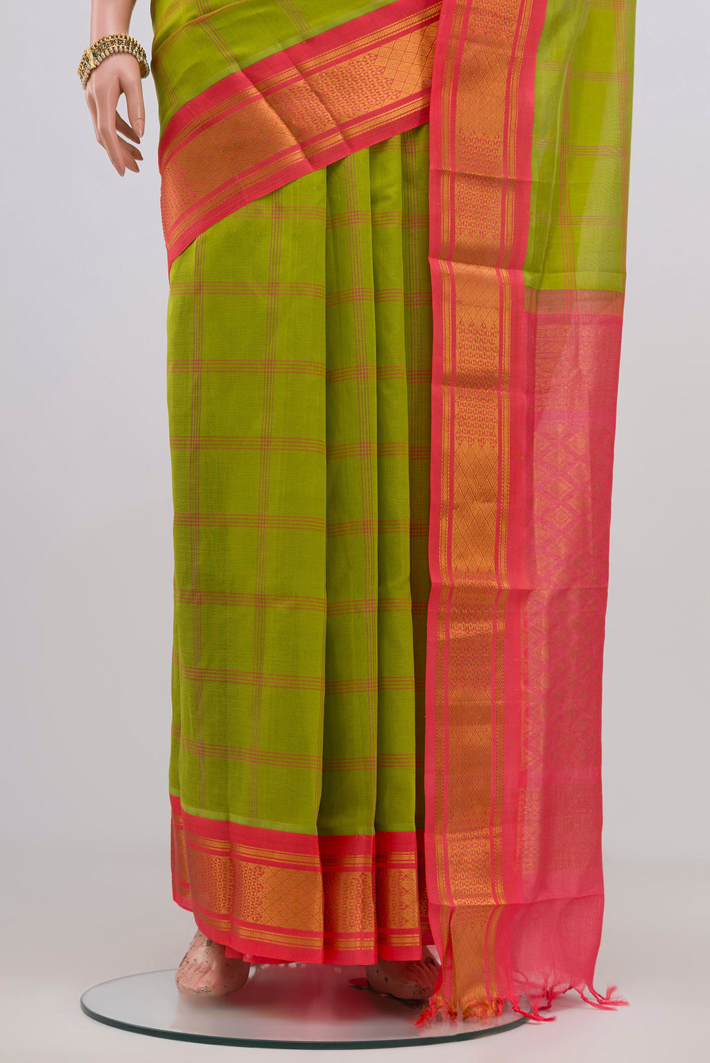 Pleats and pallu of Green Silk Cotton Saree with Checked design on the body and Zari Border. 