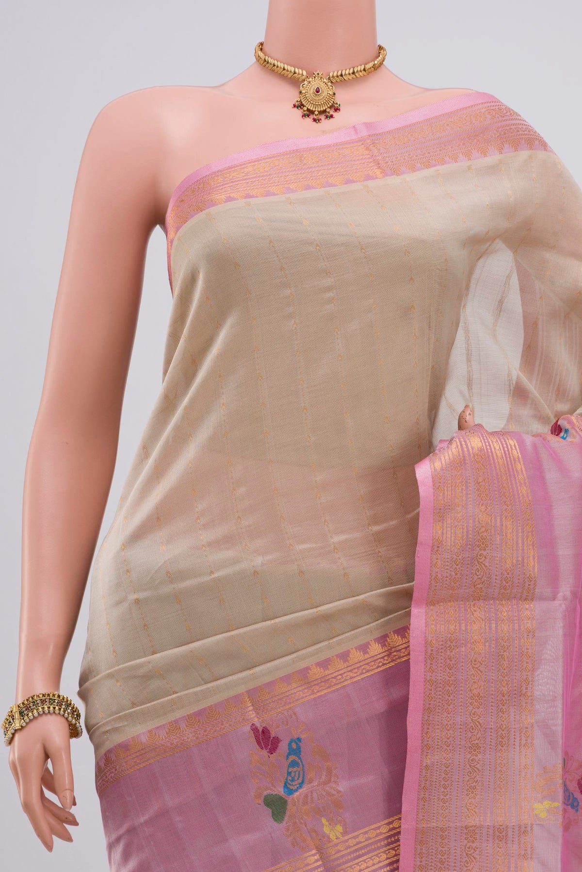 Border image of Cream Silk Cotton Saree with Stripes on the body and Zari Border. 