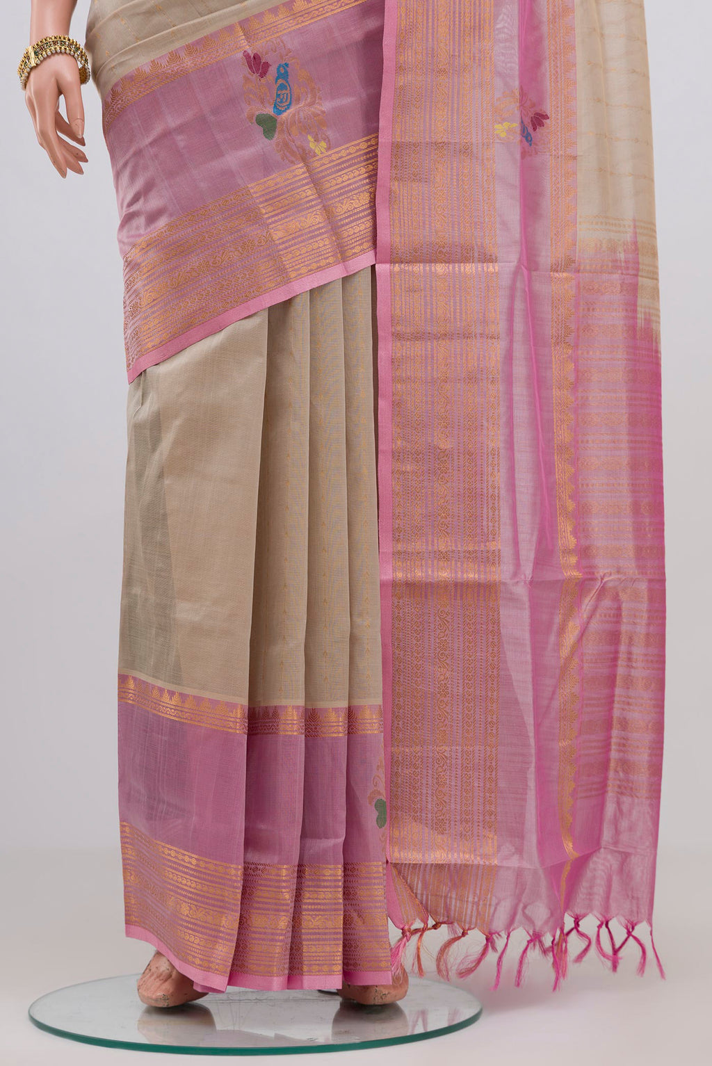 Pleats and pallu of Cream Silk Cotton Saree with Stripes on the body and Zari Border. 