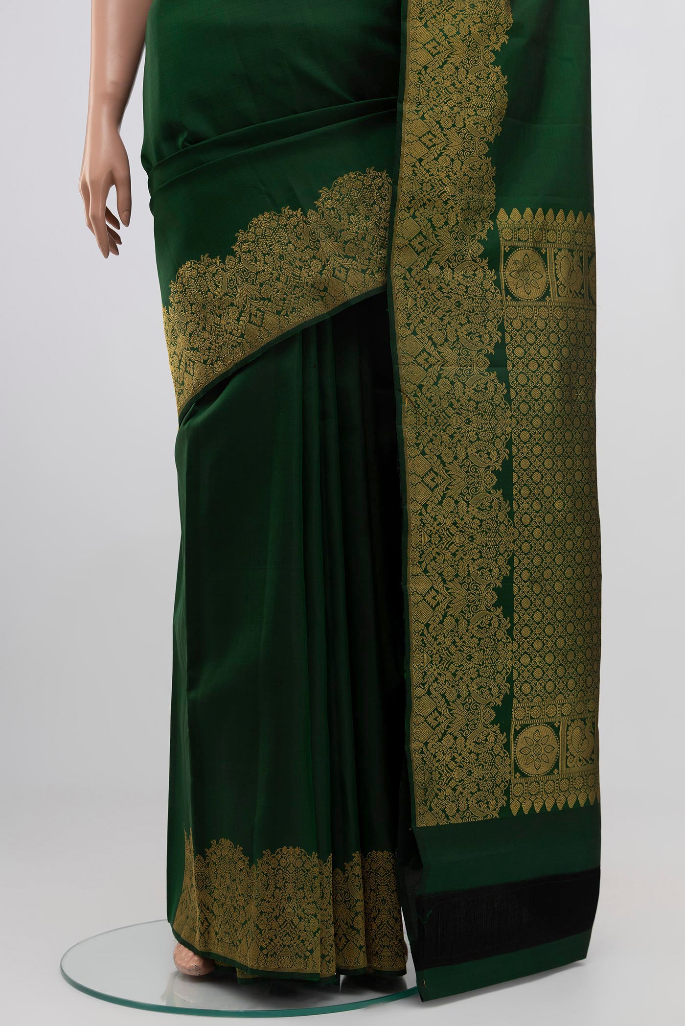 Pleats and pallu of Green Kanchipuram Silk Saree with Plain Body and Zari Border. 