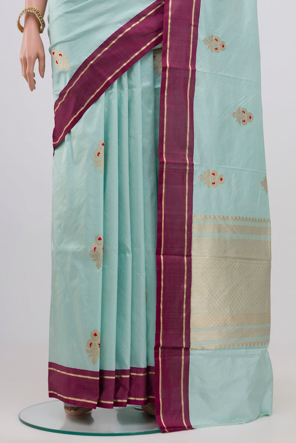 Pleats and pallu of Light Blue Banarasi Katan Silk Saree with Zari Butta on the body and Plain Border. 