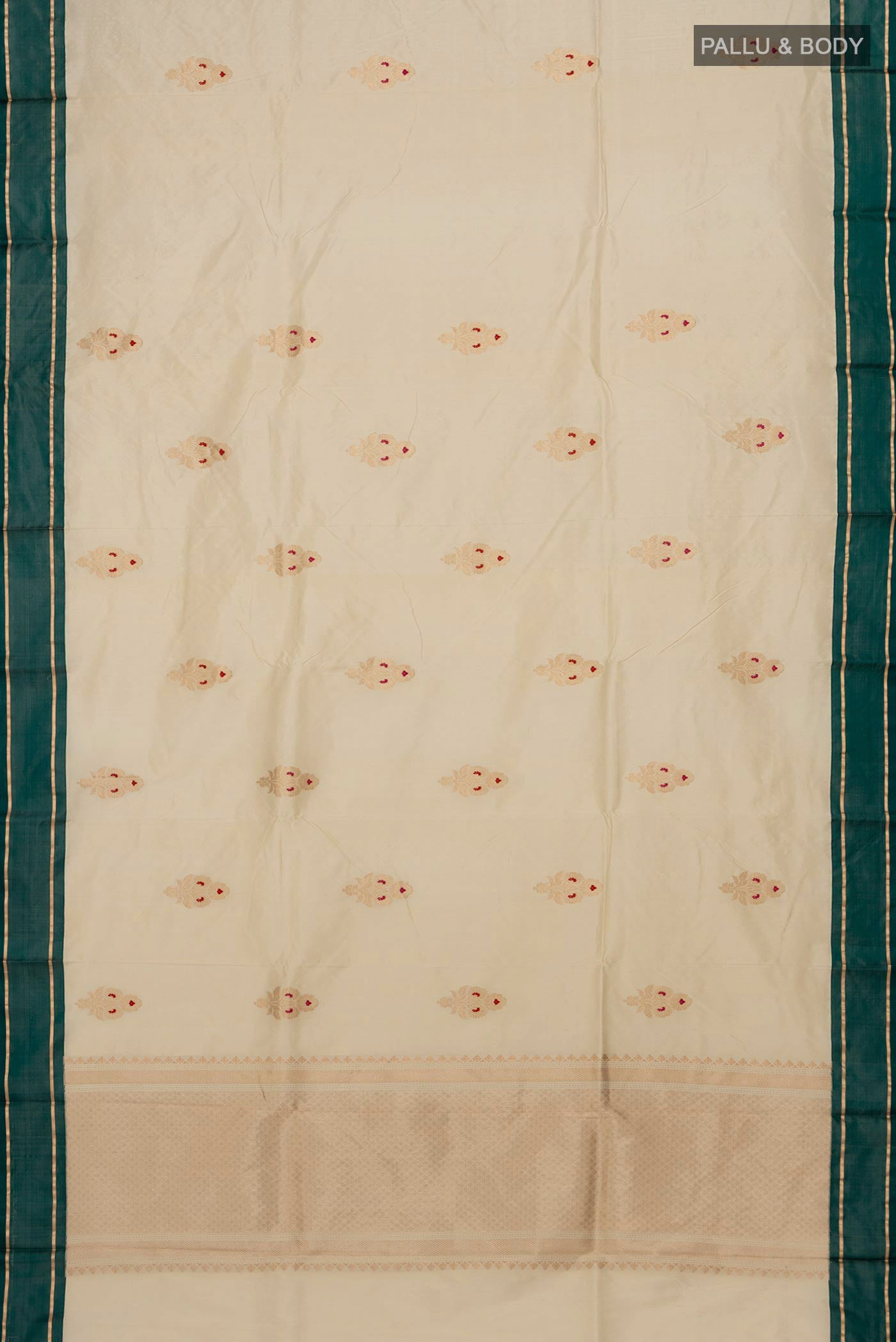 Flat view of Cream Banarasi Katan Silk Saree with Zari Butta on the body and Thin Zari Line. 