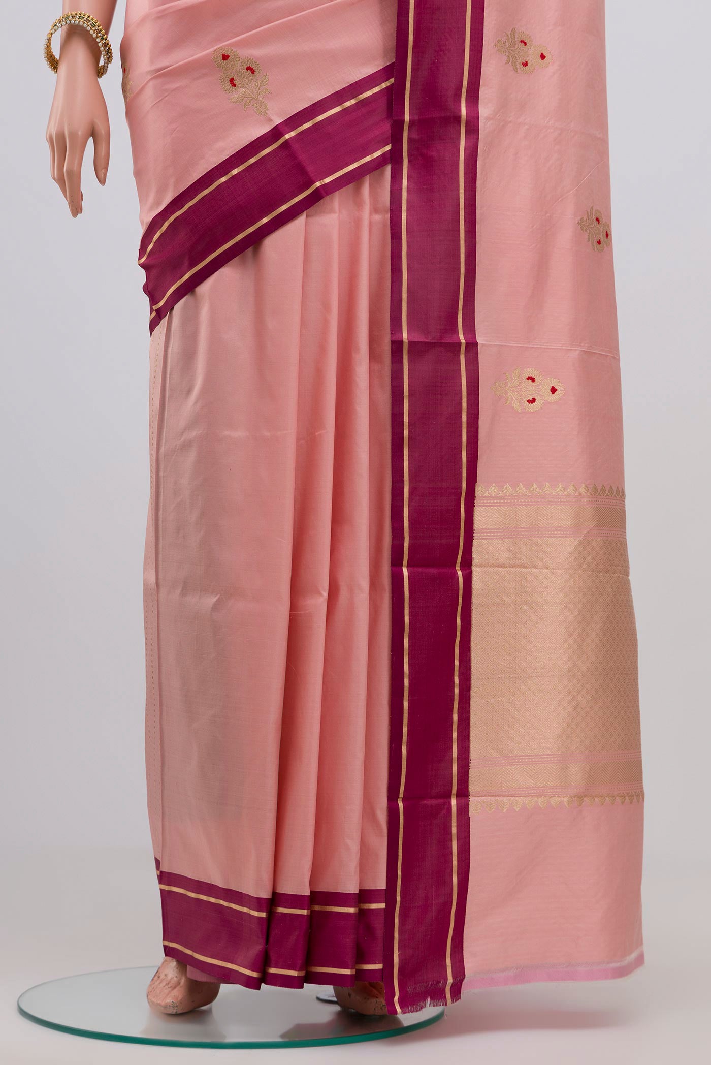 Pleats and pallu of Pink Banarasi Katan Silk Saree with Zari Butta on the body and Plain Border. 