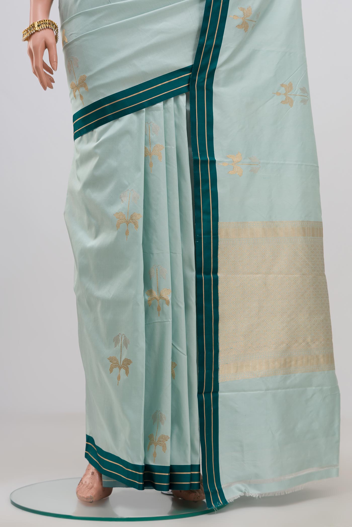 Pleats and pallu of Blue Banarasi Katan Silk Saree with Zari Butta on the body and Thin Zari Line. 