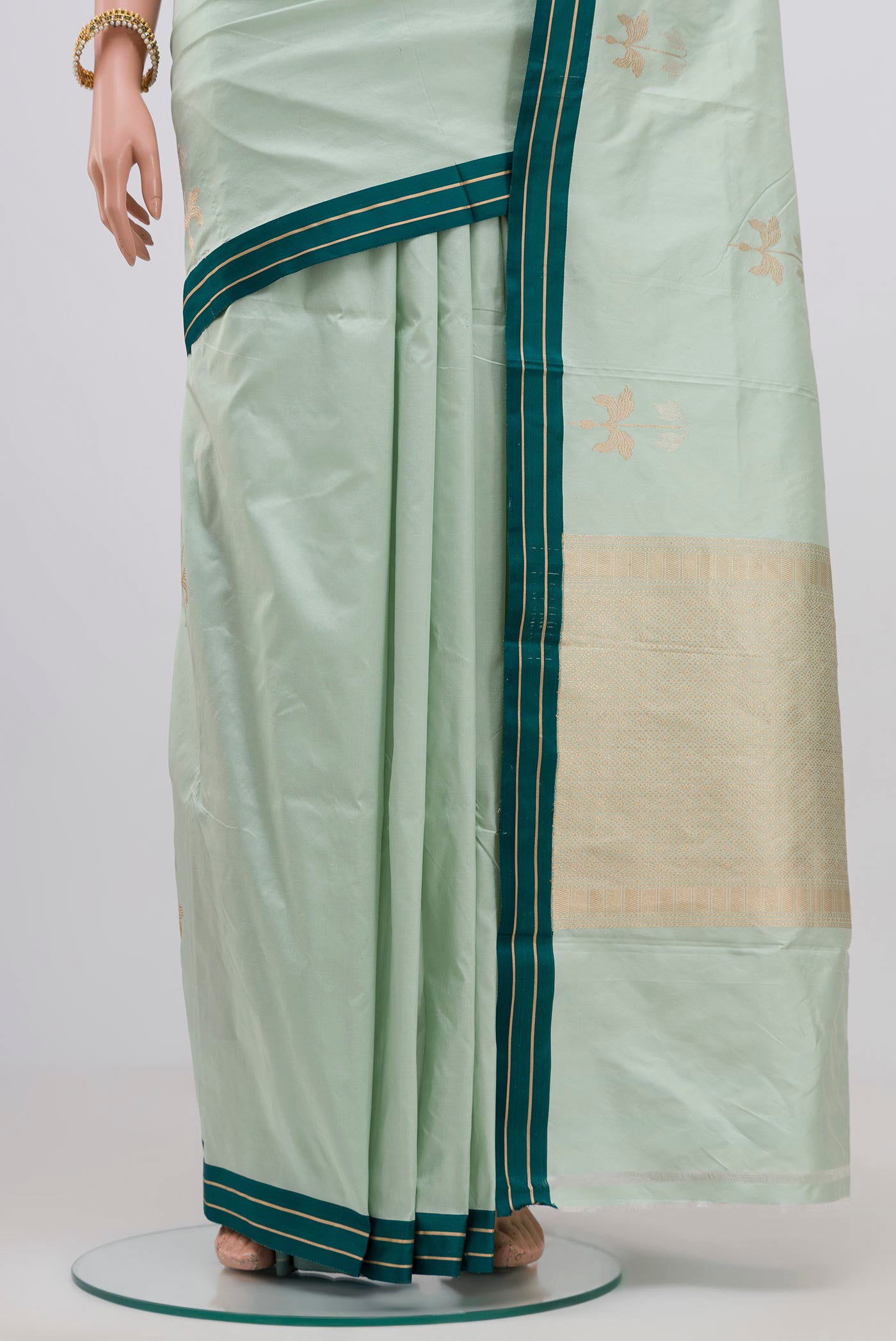 Pleats and pallu of Light Blue Banarasi Katan Silk Saree with Zari Butta on the body and Plain Border. 
