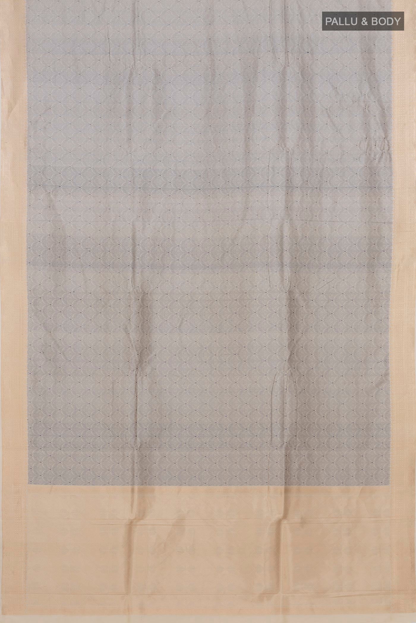 Flat view of Cream Banarasi Katan Silk Saree with Jacquard design on the body and Thread Border. 