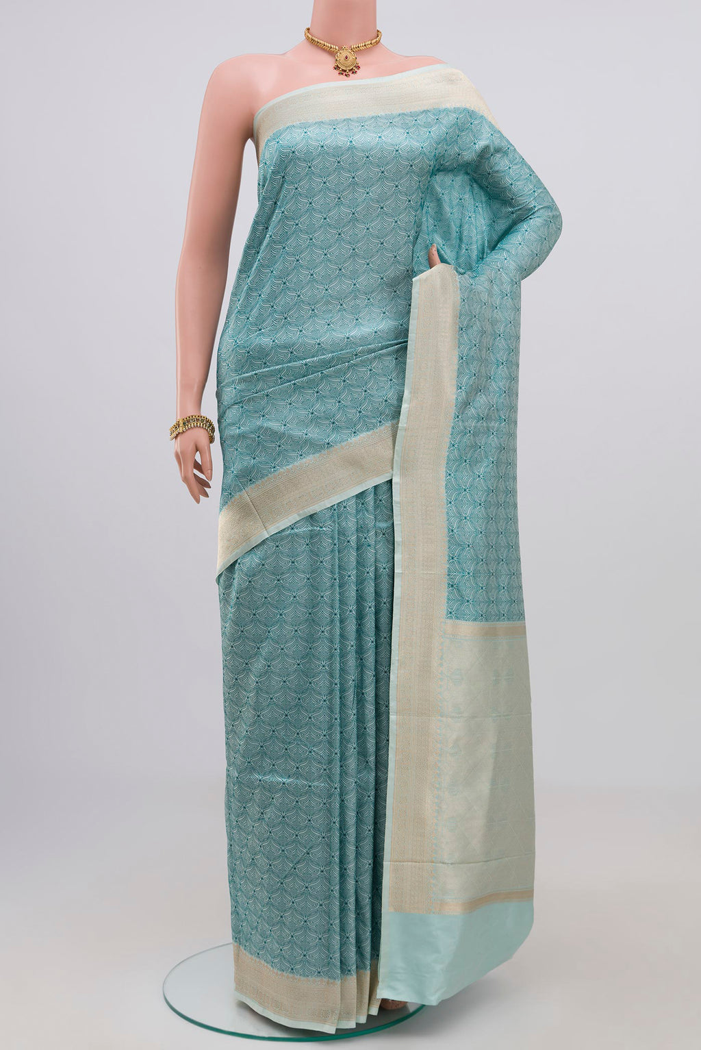 Light Blue Banarasi Katan Silk Saree with Jacquard design on the body and Zari Border.  displayed on a mannequin