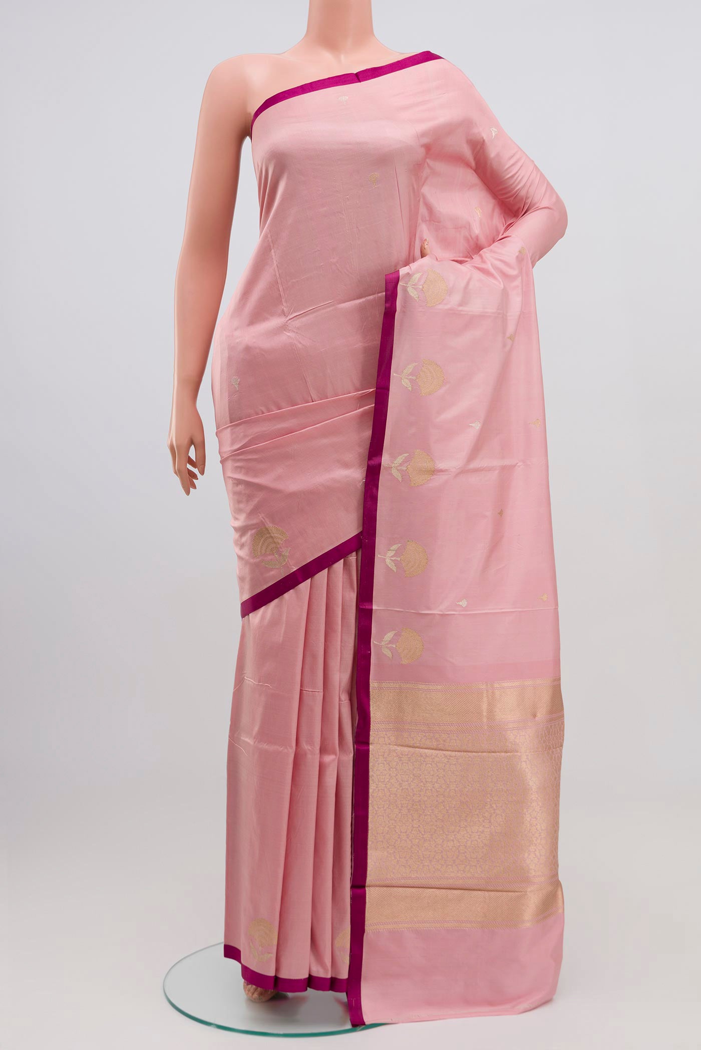 Pink Banarasi Katan Silk Saree with Zari Butta on the body and Plain Border.  displayed on a mannequin