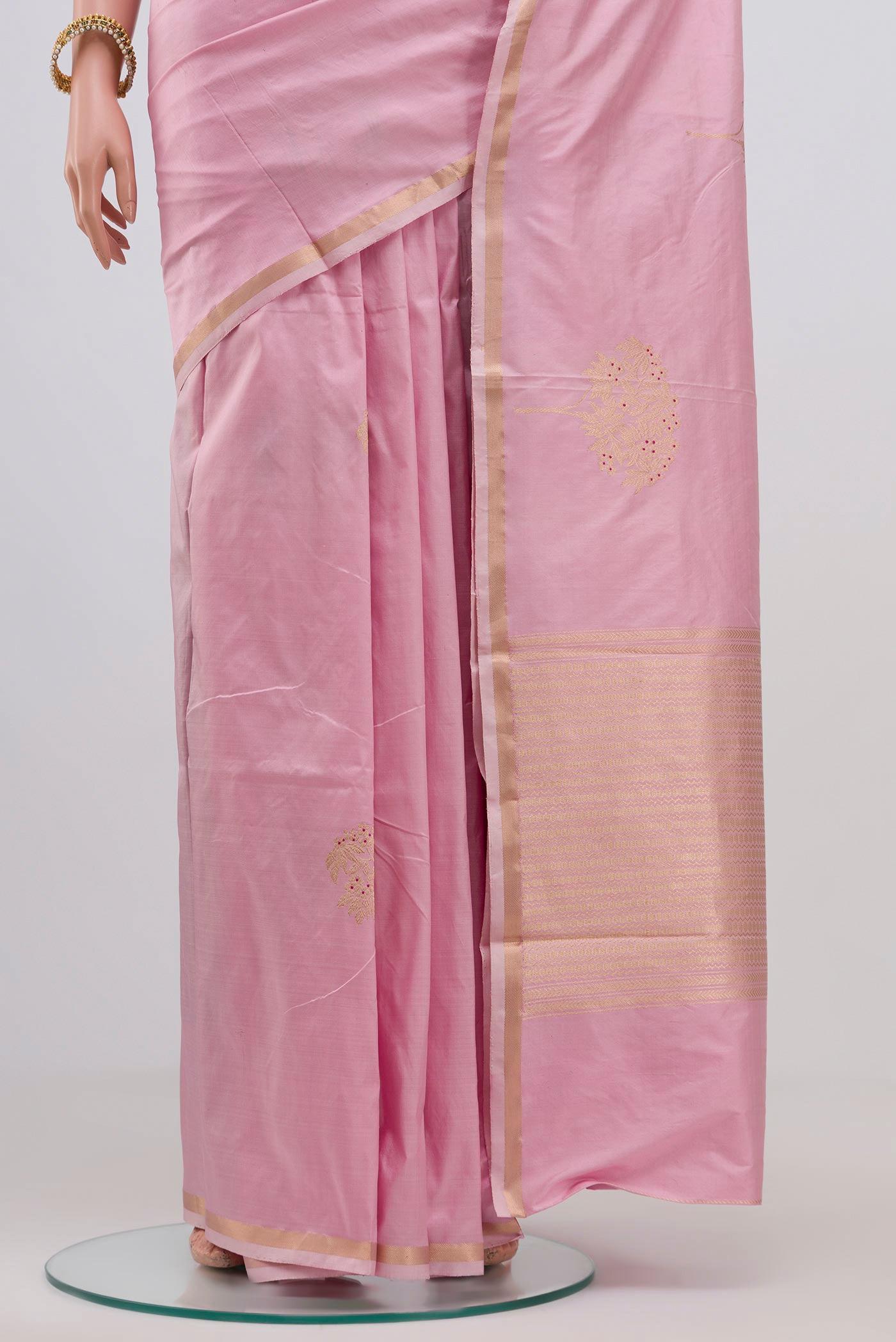 Pleats and pallu of Rose pink Banarasi Katan Silk Saree with Zari Butta on the body and Zari Border. 