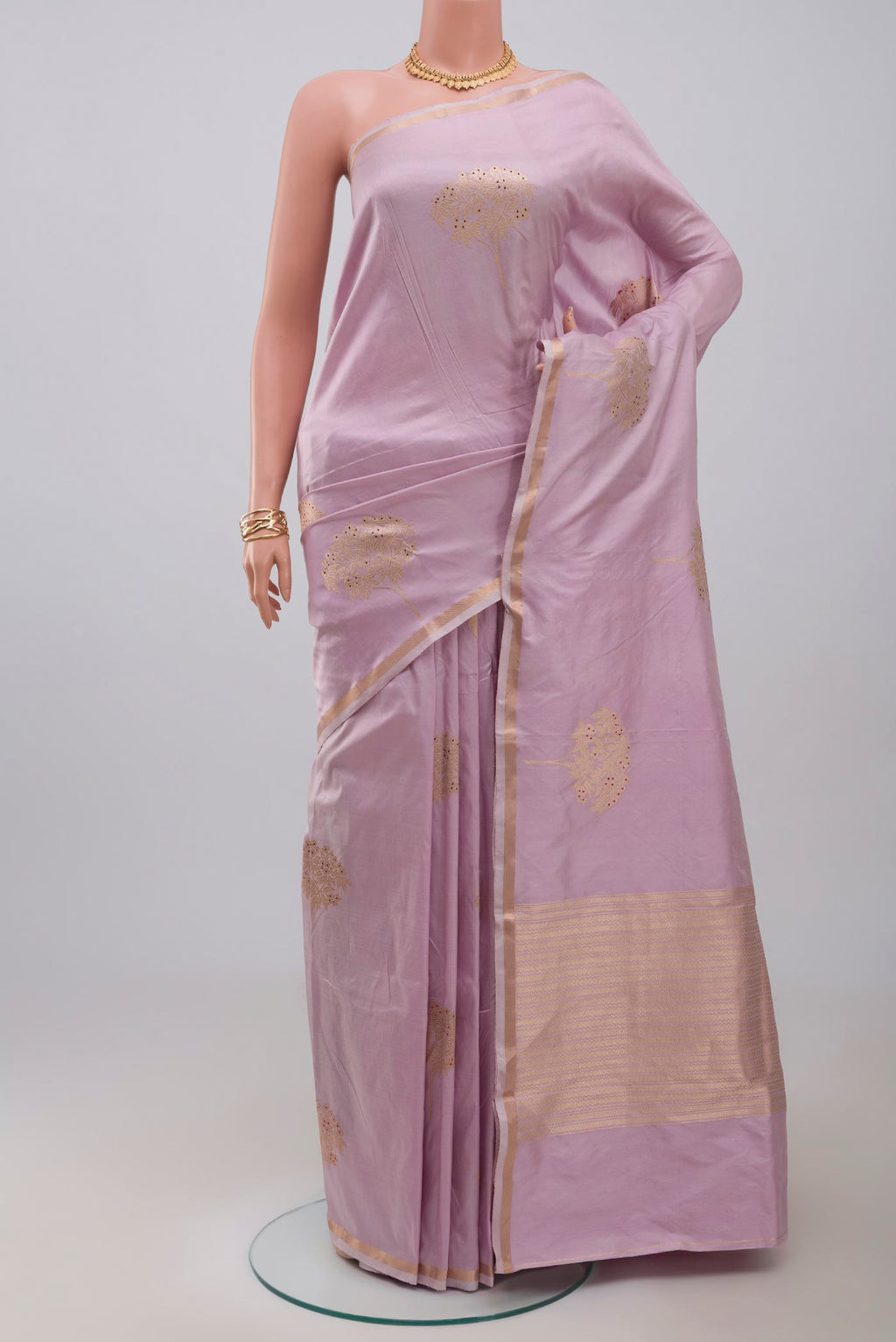 Lavender Banarasi Katan Silk Saree with Zari Butta on the body and Thin Zari Line.  displayed on a mannequin