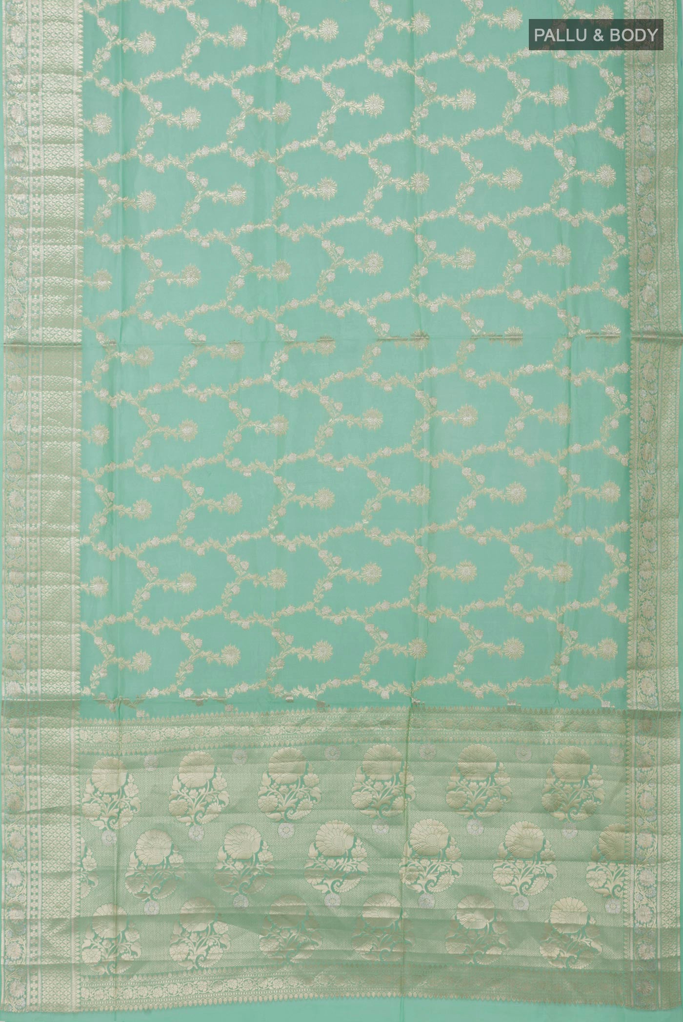 Flat view of Light Green Raw Silk Saree with Zari Butta on the body and Zari Border. 
