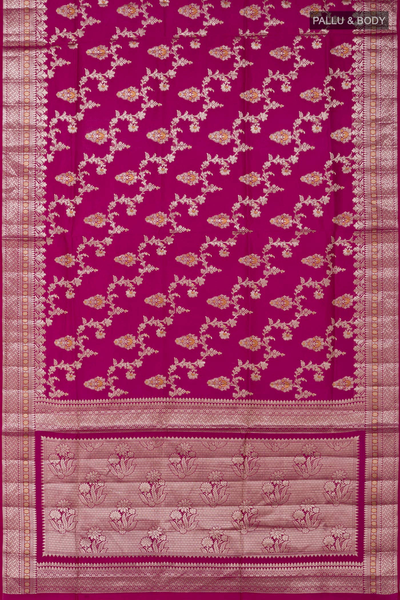 Flat view of Rani Pink Raw Silk Saree with Zari Butta on the body and Zari Border. 