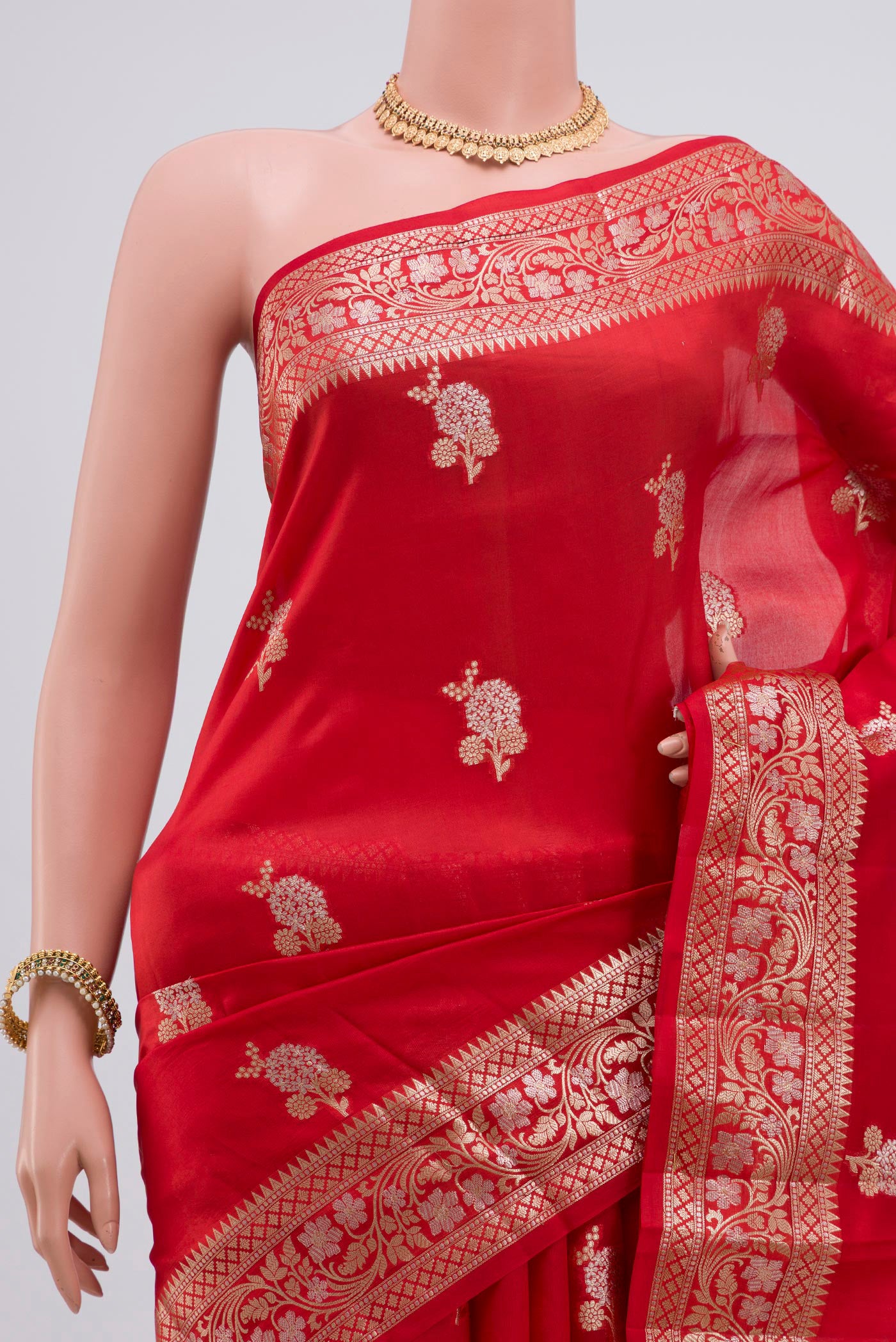 Border image of Red Raw Silk Saree with Zari Butta on the body and Zari Border. 