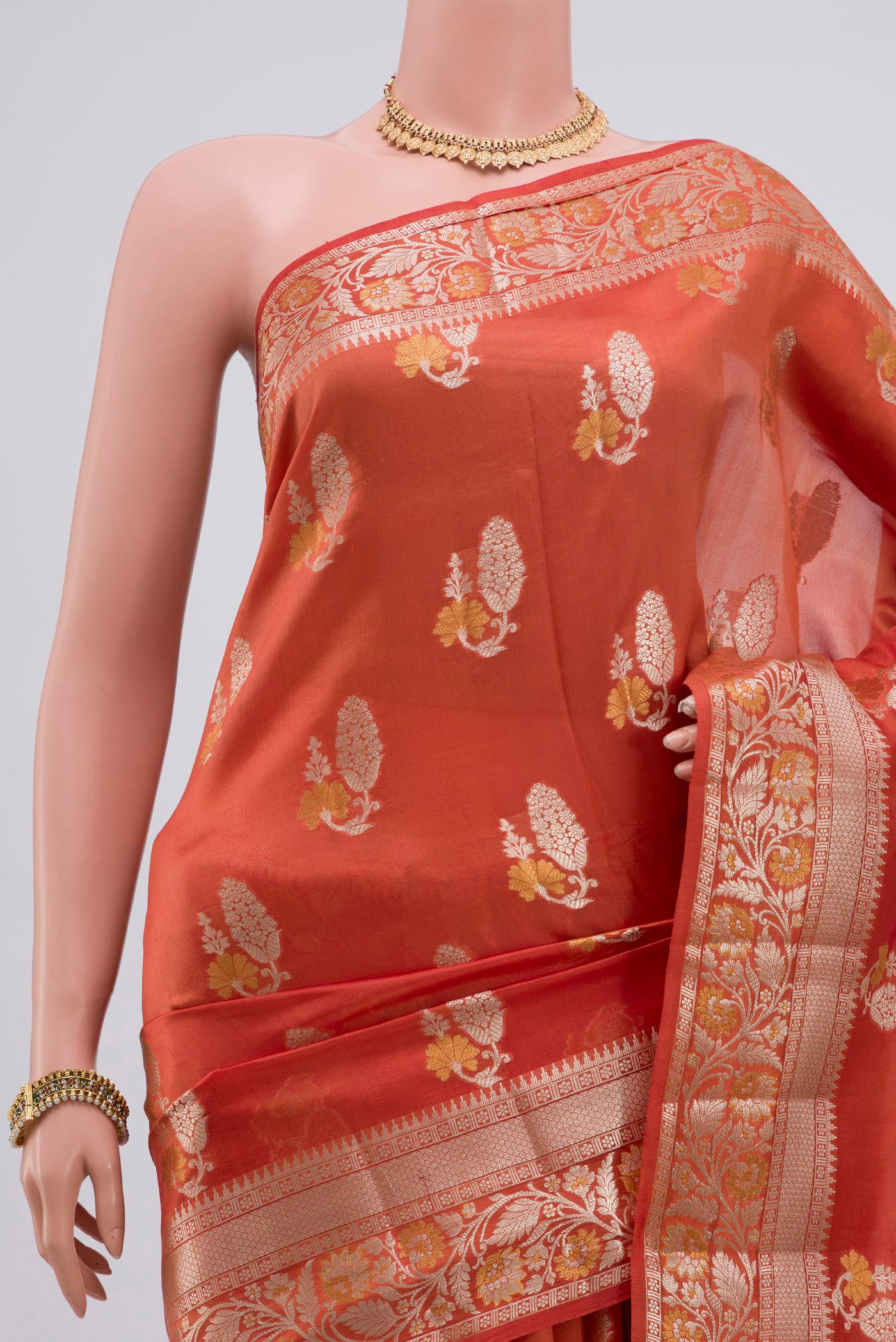 Border image of Peach Raw Silk Saree with Zari Butta on the body and Zari Border. 