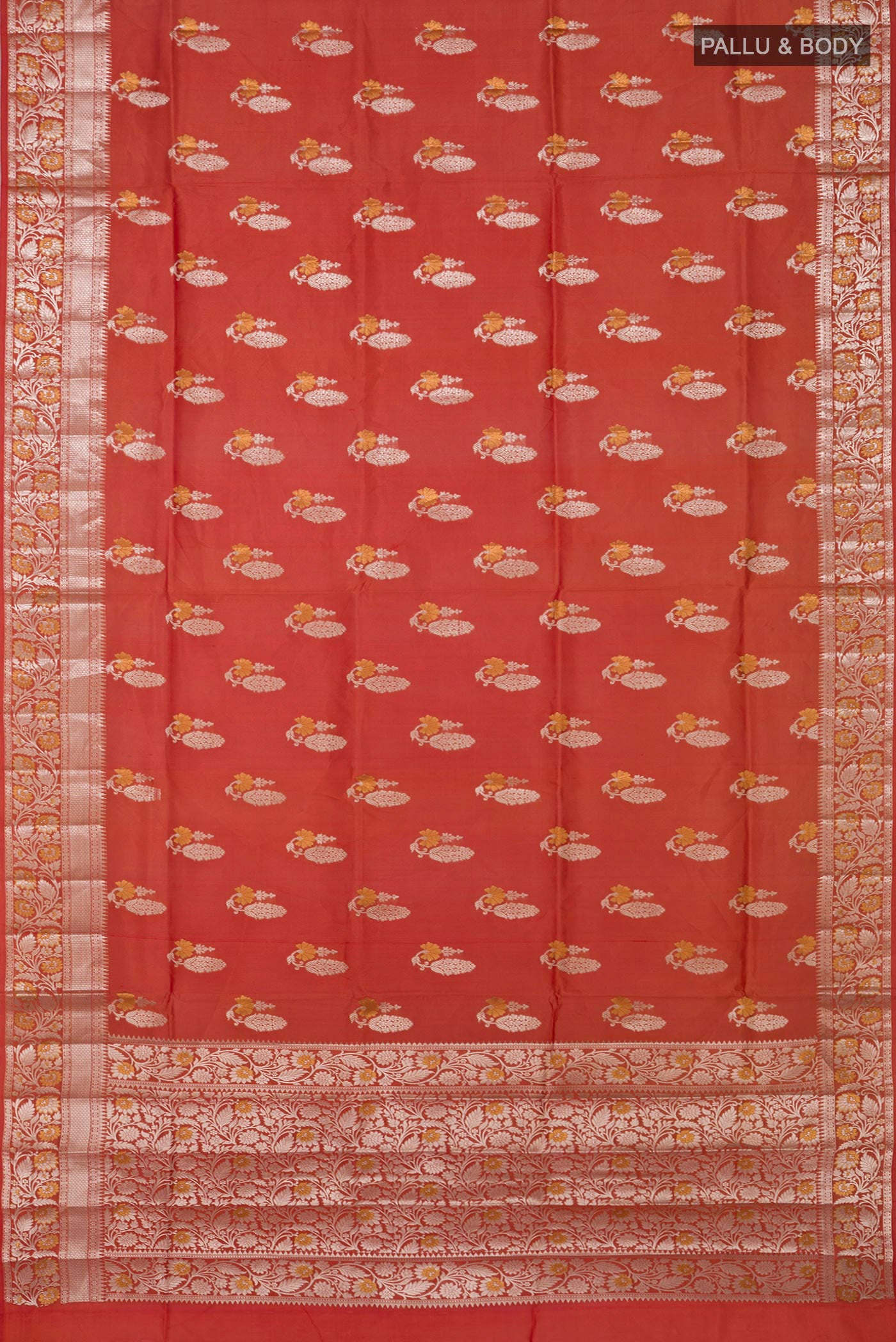 Flat view of Peach Raw Silk Saree with Zari Butta on the body and Zari Border. 