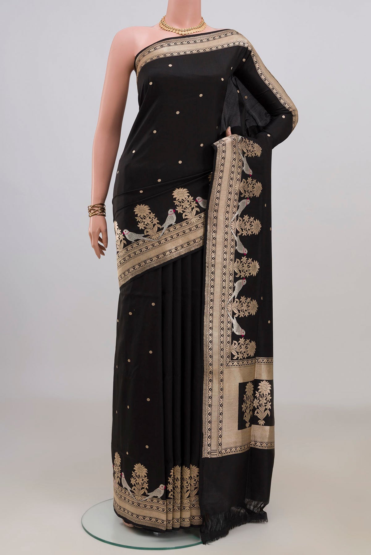 Pure Silk Black Banarasi Saree with Zari Butta on the body and Fancy Border.  displayed on a mannequin