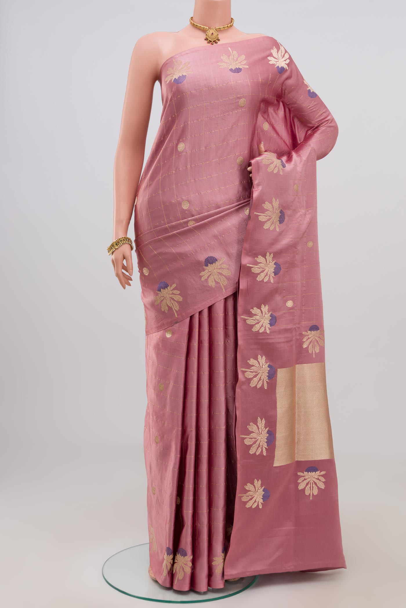 Pink Banarasi Saree with Checked design on the body and Fancy Border.  displayed on a mannequin