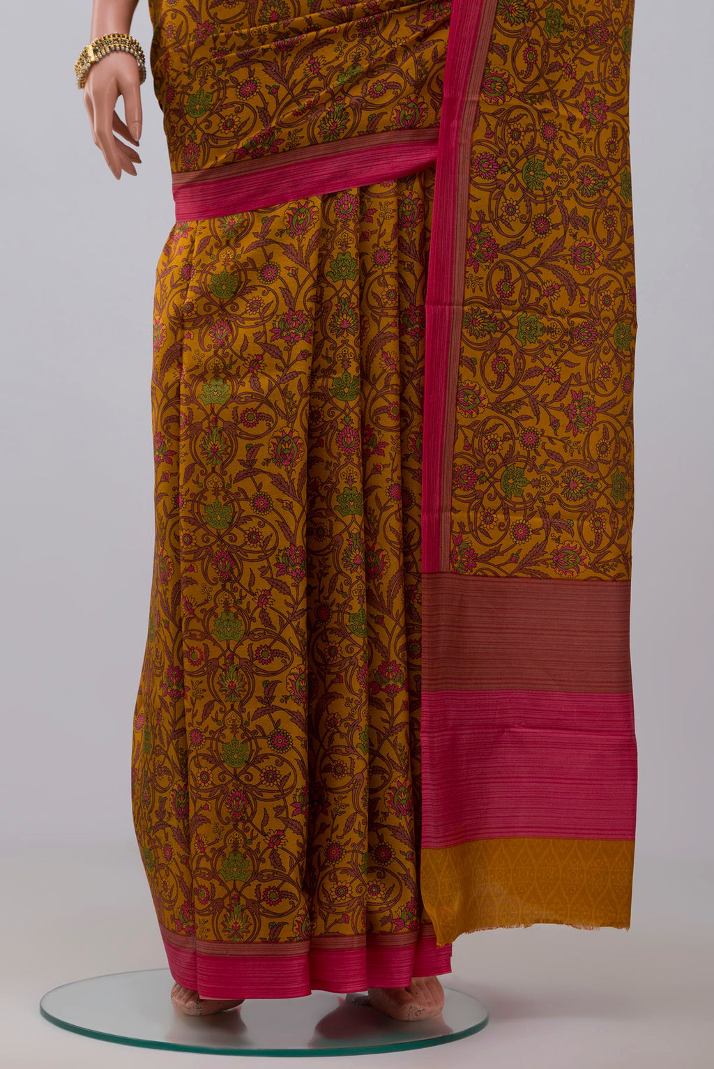 Pleats and pallu of Yellow Printed Silk Saree with Printed design on the body and Plain Border. 