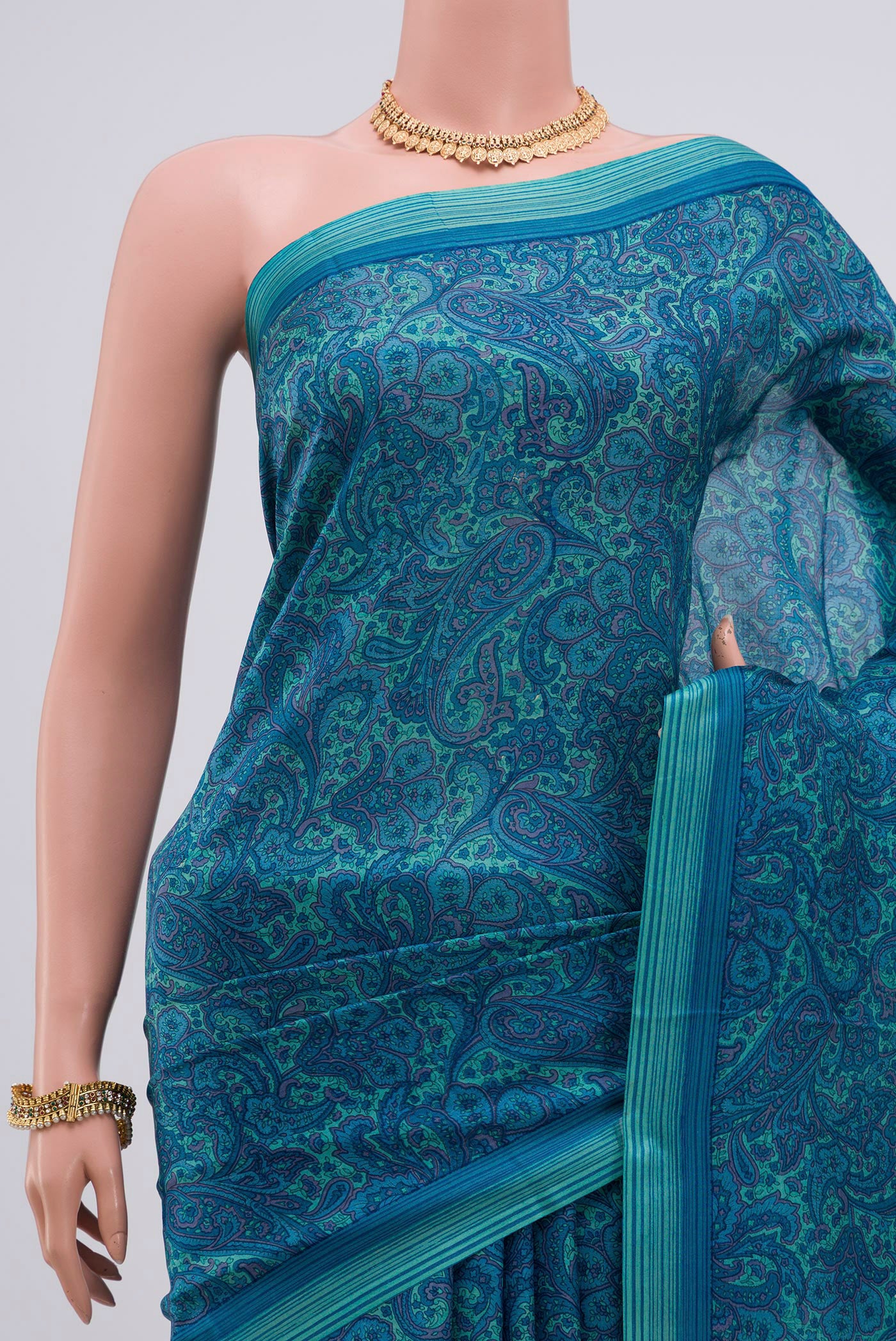 Border image of Blue Printed Silk Saree with Printed design on the body and Plain Border. 