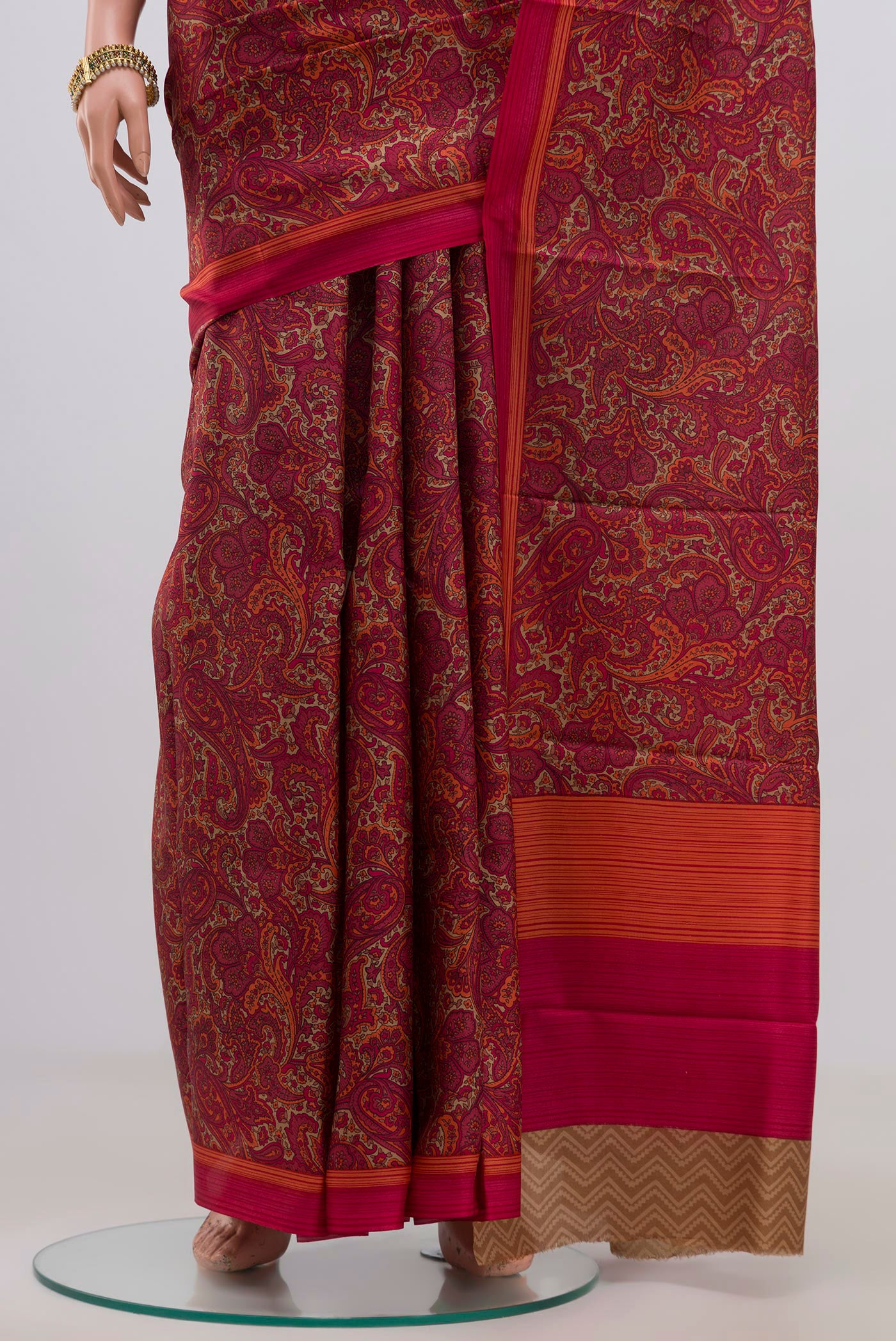 Pleats and pallu of Red Printed Silk Saree with Printed design on the body and Plain Border. 