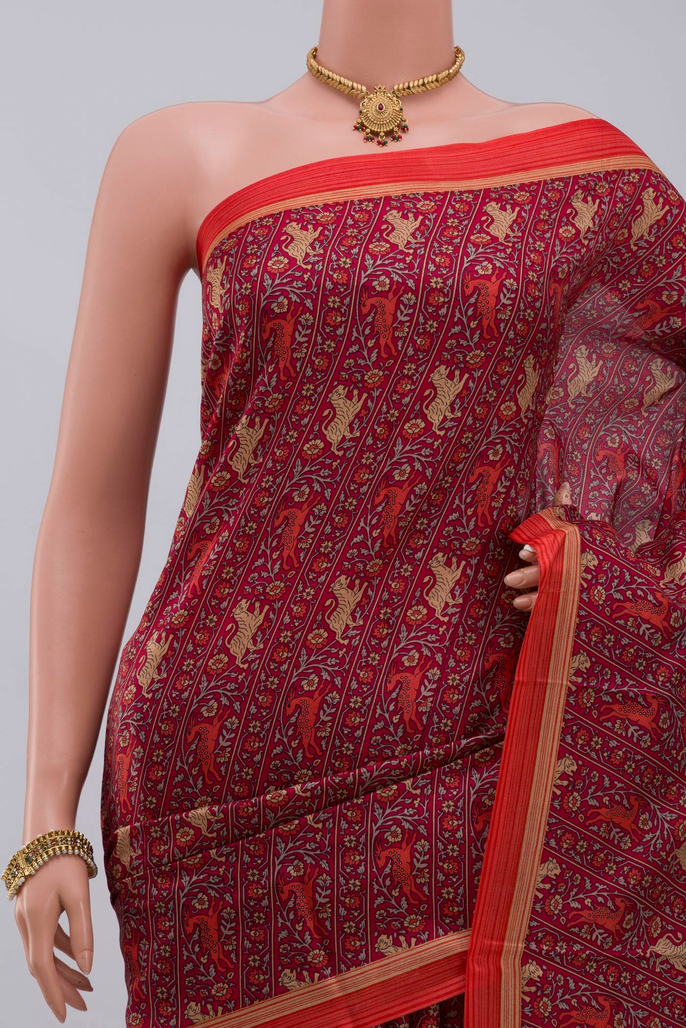 Border image of Red Printed Silk Saree with Printed design on the body and Plain Border. 