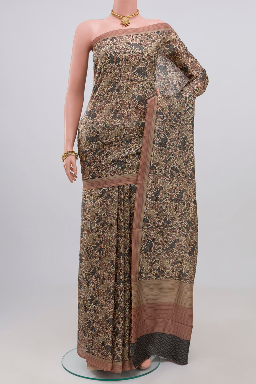 Cream Printed Silk Saree with Printed design on the body and Plain Border.  displayed on a mannequin