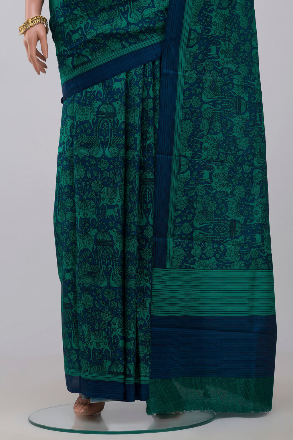 Pleats and pallu of Blue Printed Silk Saree with Printed design on the body and Plain Border. 