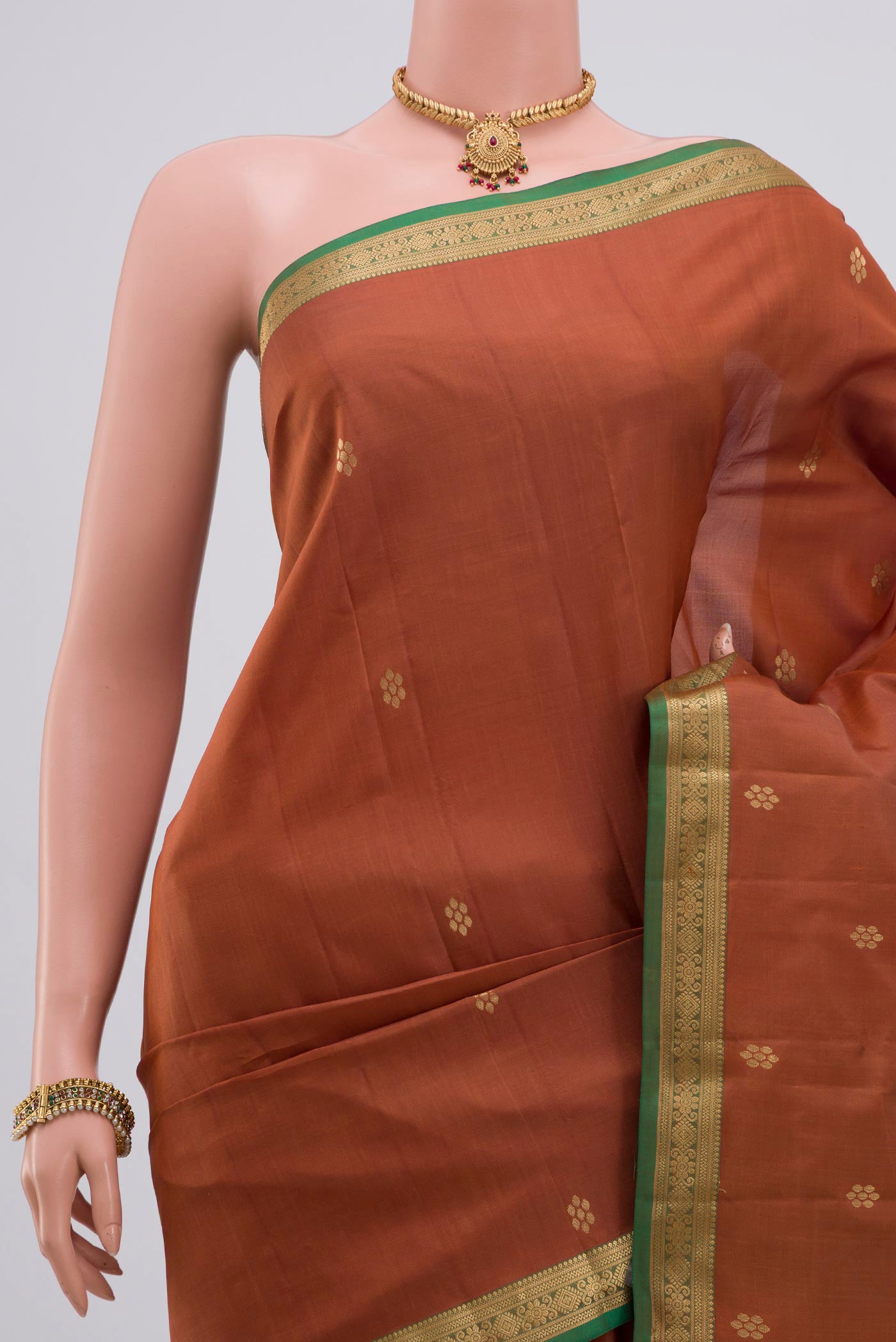 Border image of Brown Kanjivaram Silk Saree with Zari Butta on the body and Zari Border. 