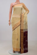 Cream Uppada Silk Saree with Zari And Thread Butta on the body and Zari Border.  displayed on a mannequin