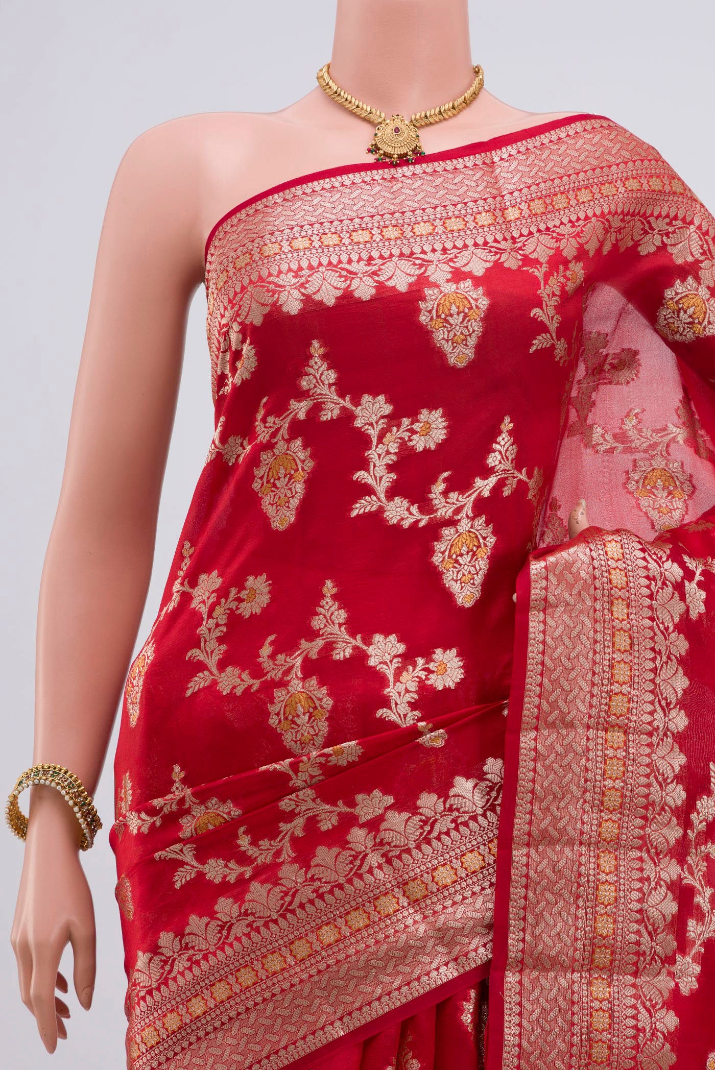 Border image of Red Raw Silk Saree with Zari Butta on the body and Zari Border. 