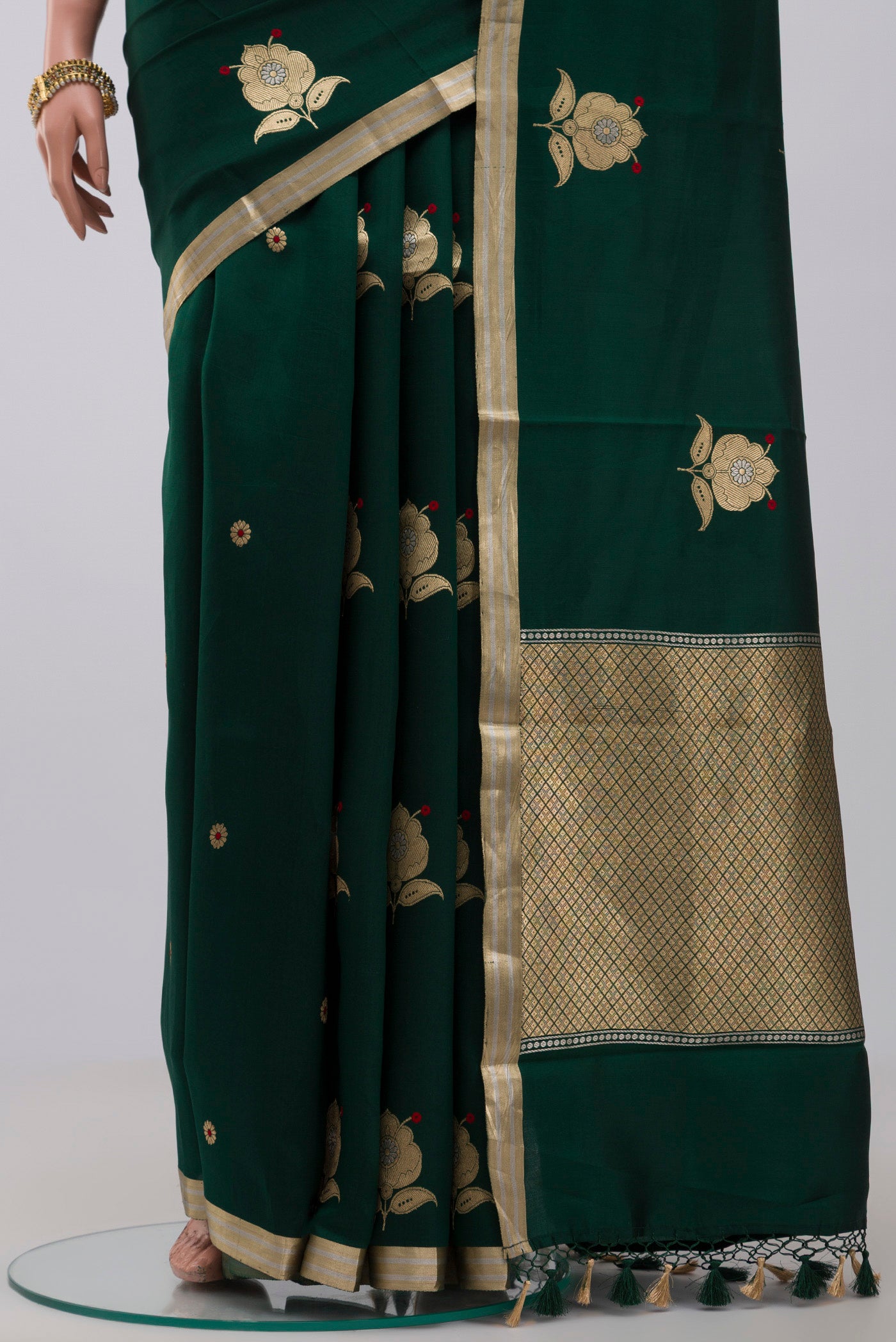 Pleats and pallu of Green Banarasi Katan Silk Saree with Zari Butta on the body and Zari Border. 