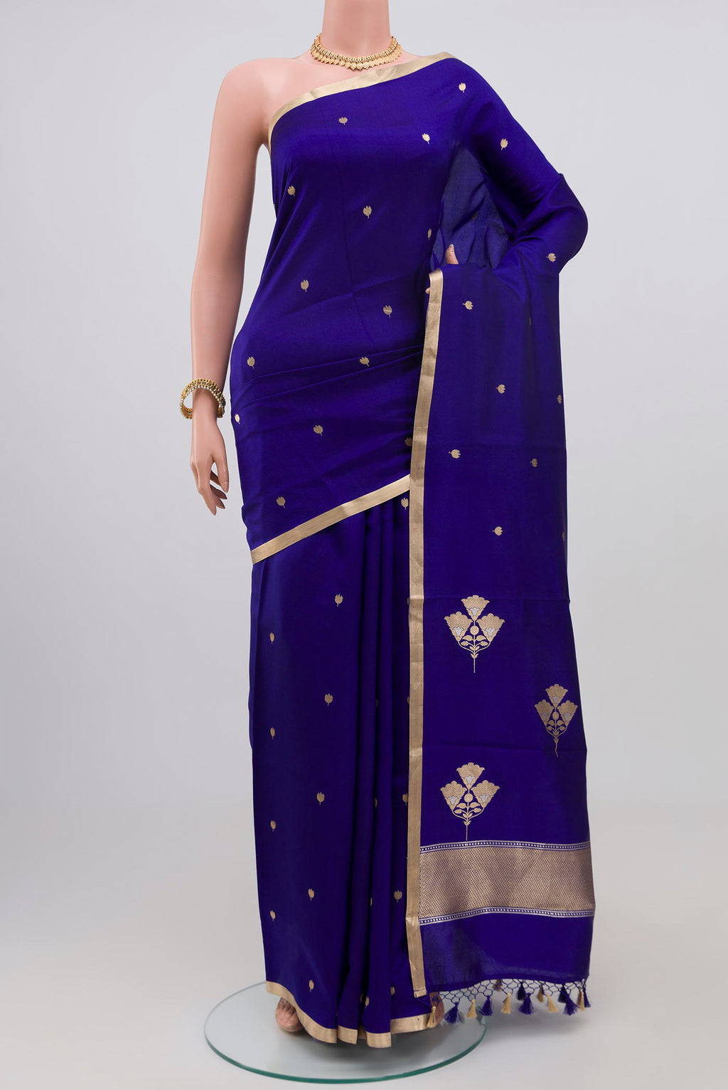 Dark Blue Banarasi Katan Silk Saree with Zari Butta on the body and Zari Border.  displayed on a mannequin