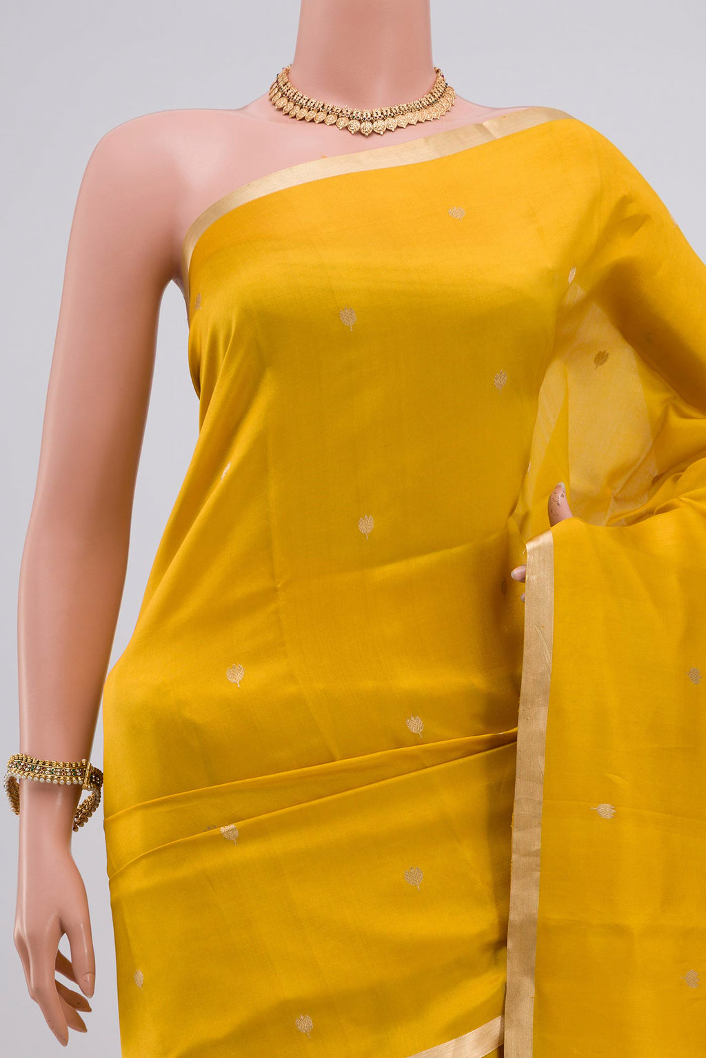 Border image of Yellow Banarasi Katan Silk Saree with Zari Butta on the body and Zari Border. 