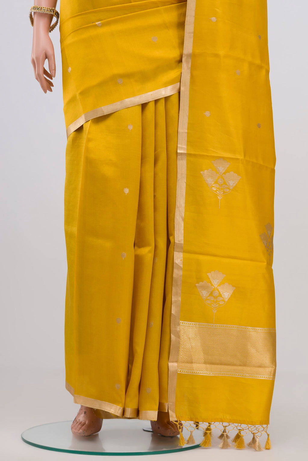 Pleats and pallu of Yellow Banarasi Katan Silk Saree with Zari Butta on the body and Zari Border. 