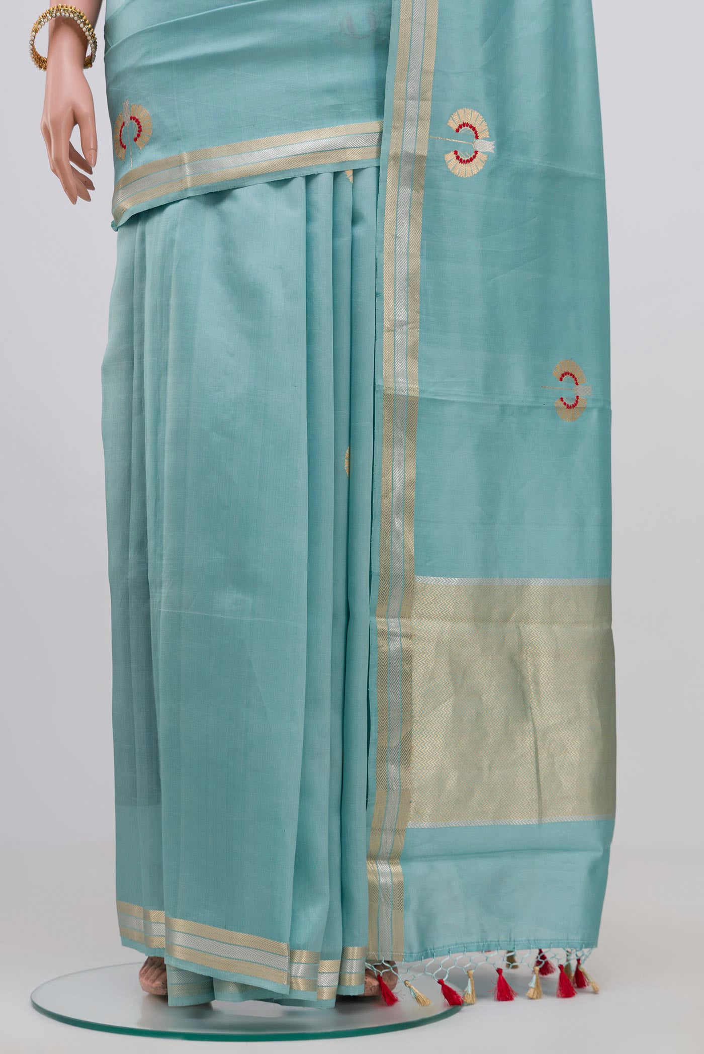 Pleats and pallu of Sky Blue Banarasi Katan Silk Saree with Zari Butta on the body and Zari Border. 
