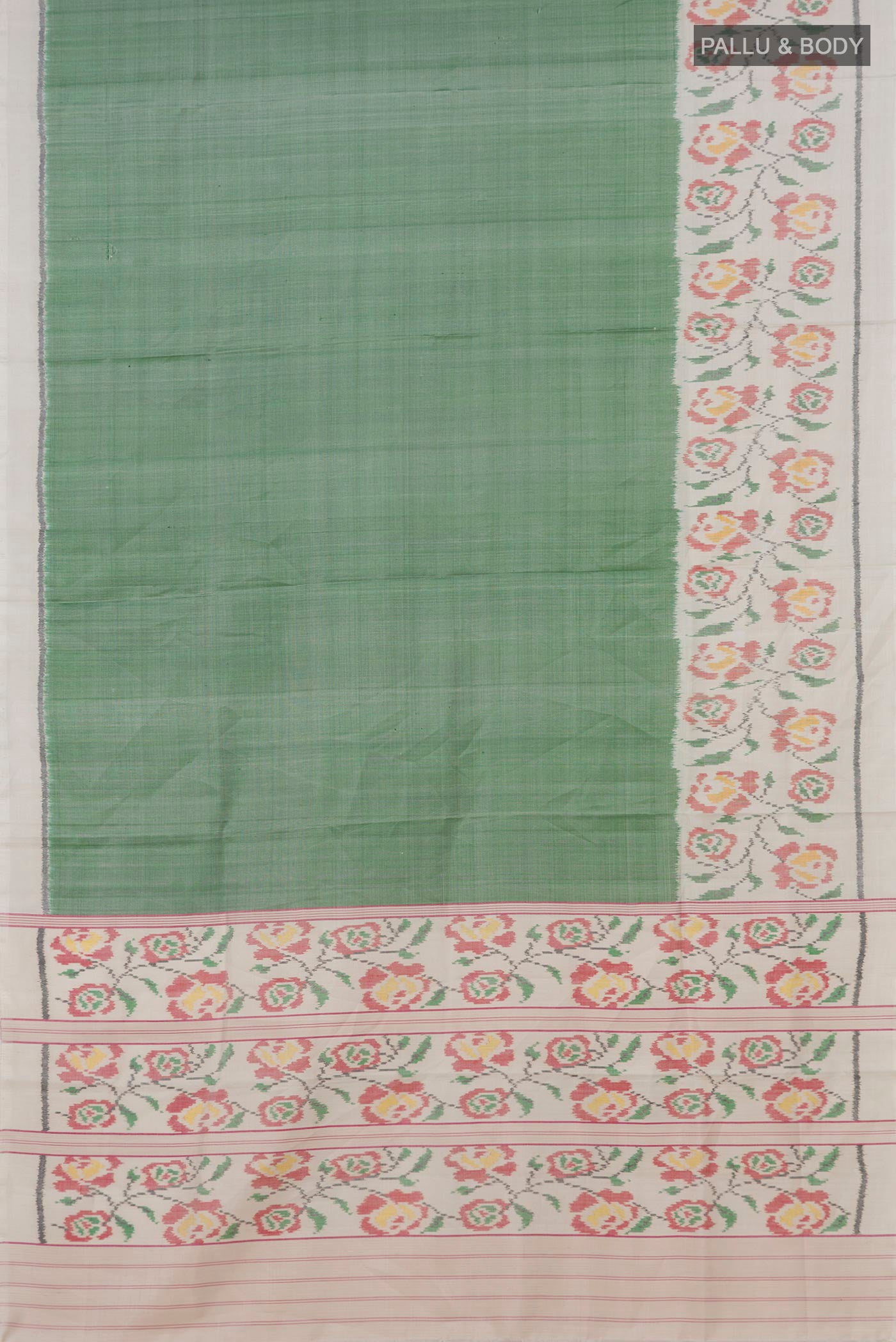 Flat view of Light Green Rajkot Patola Silk Saree with Plain Body and Plain Border. 