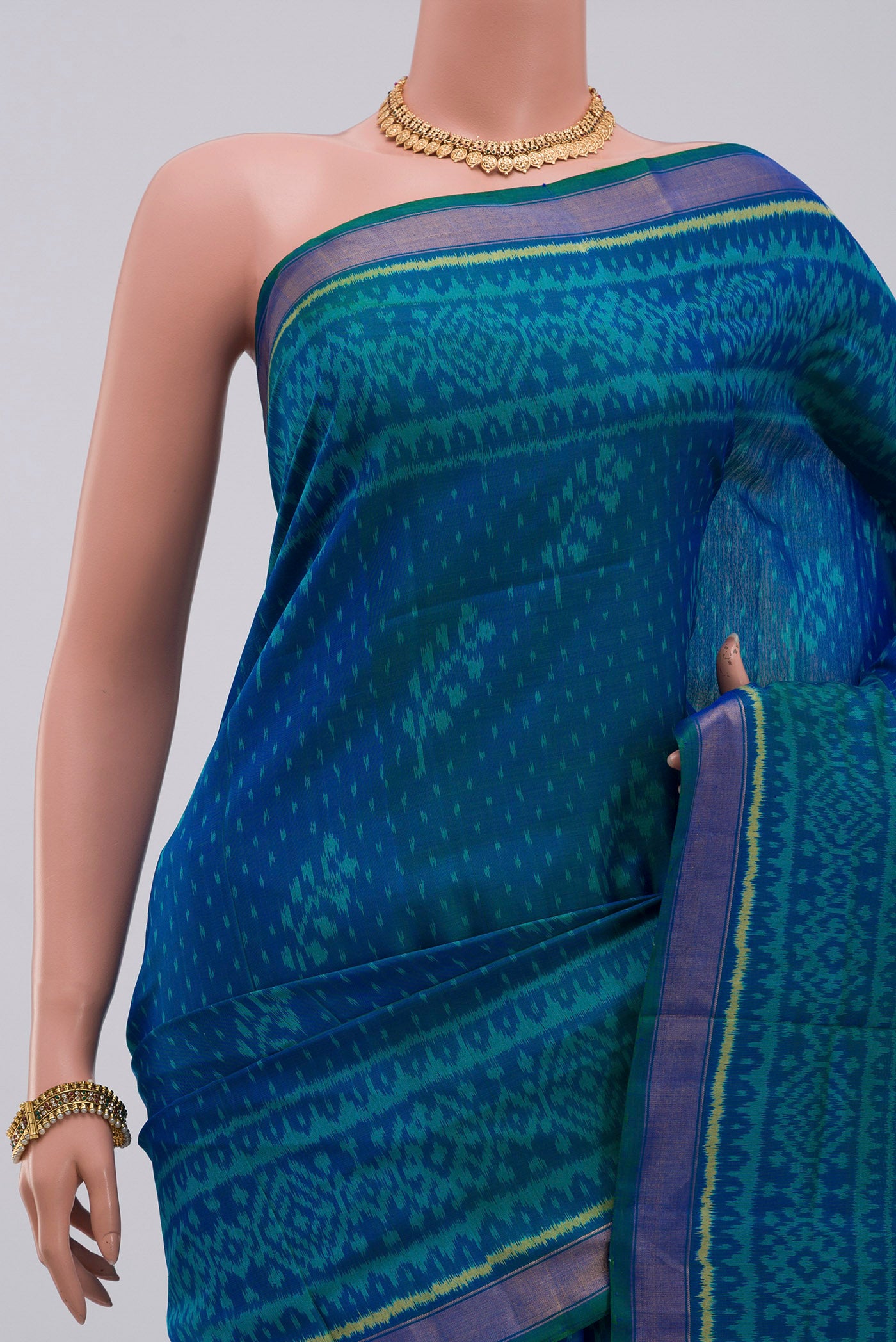 Border image of Blue Rajkot Patola Silk Saree with Ikat Print on the body and Zari Border. 